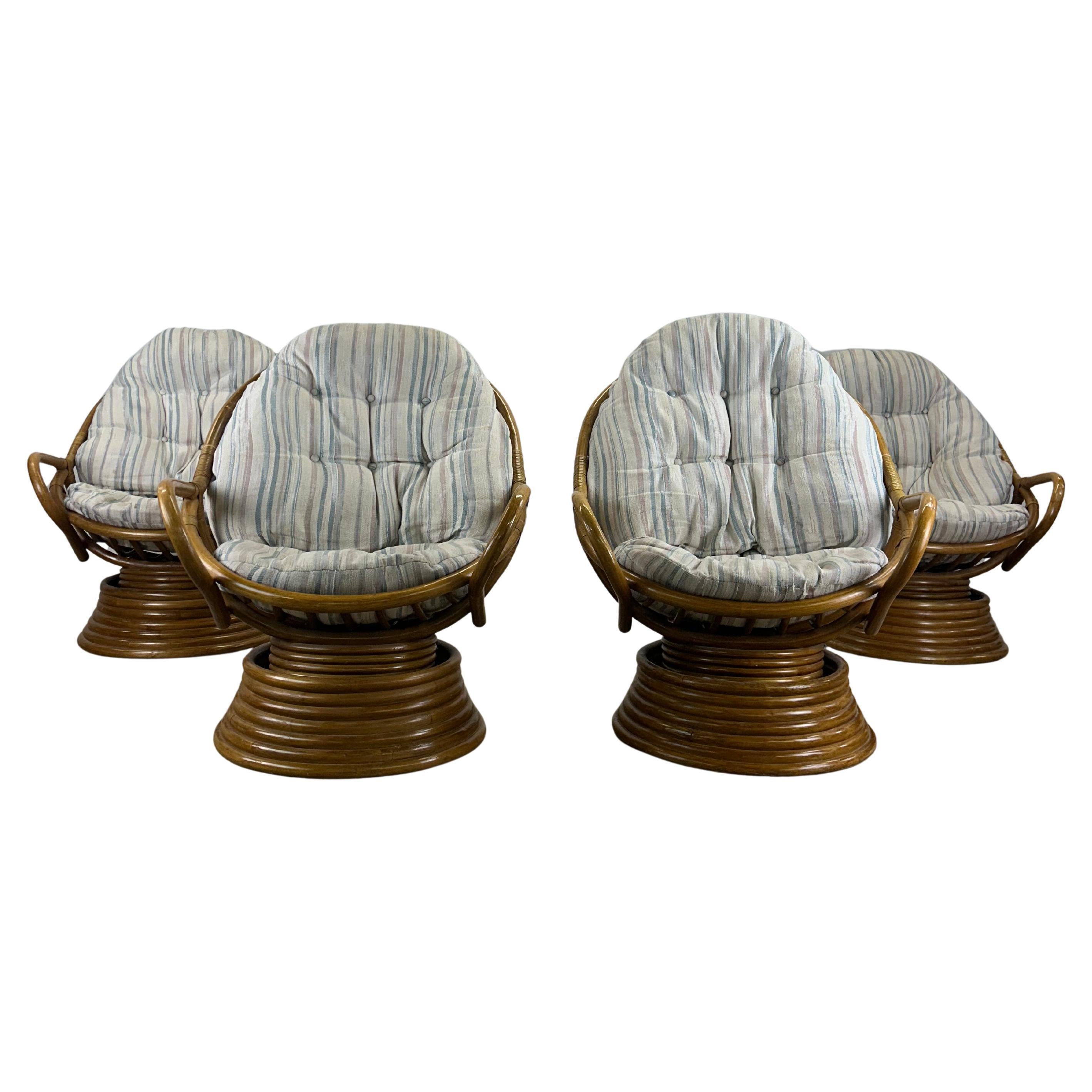 Set of 4 vintage rattan accent chairs with swivel base
