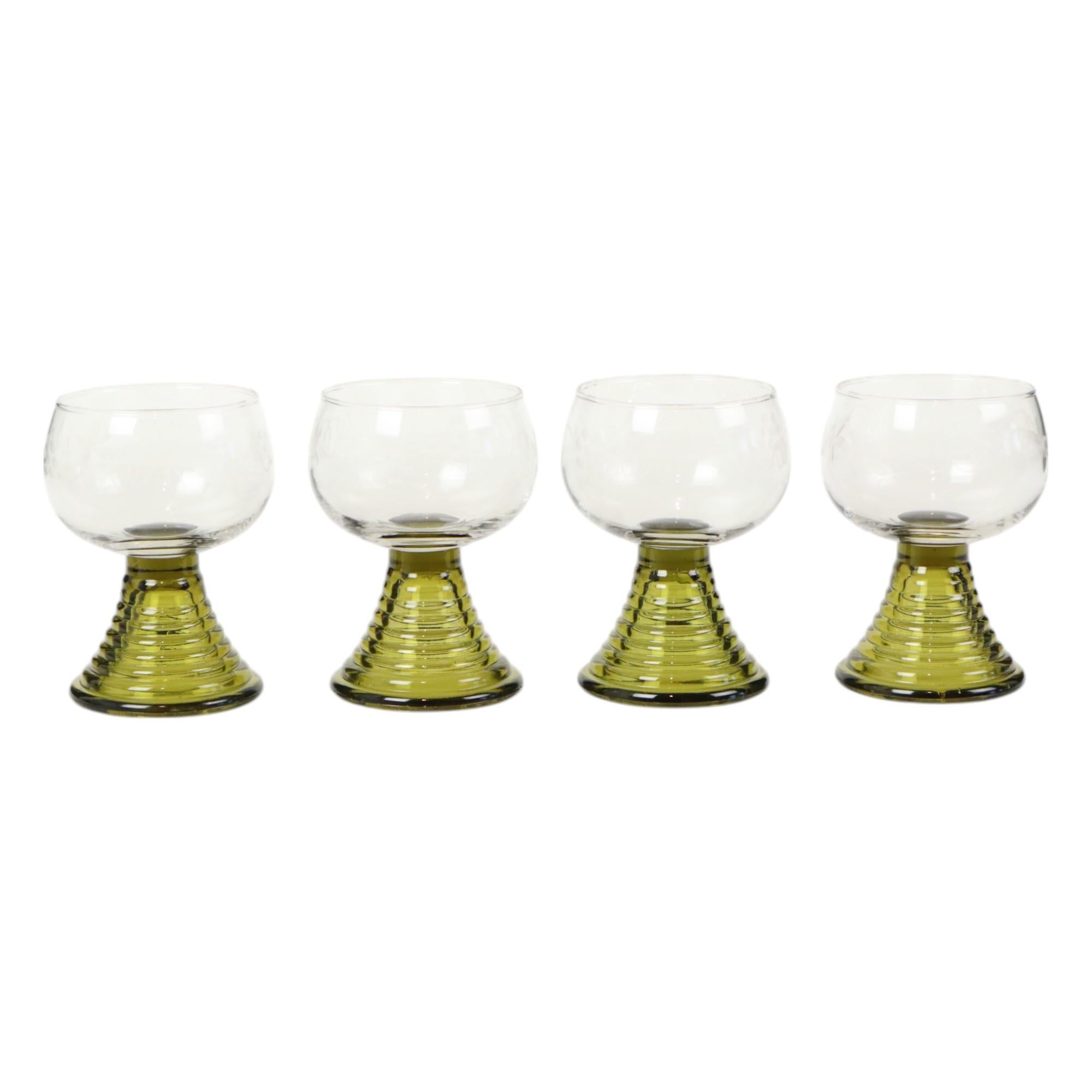 Set of 4 vintage crystal Roemer glasses with etched floral decoration, circa 1960s, Germany.

Very nice shot or wine glasses with a capacity of approximately 150ml, these are authentic vintage glasses with air bubbles in the glass, they are not all