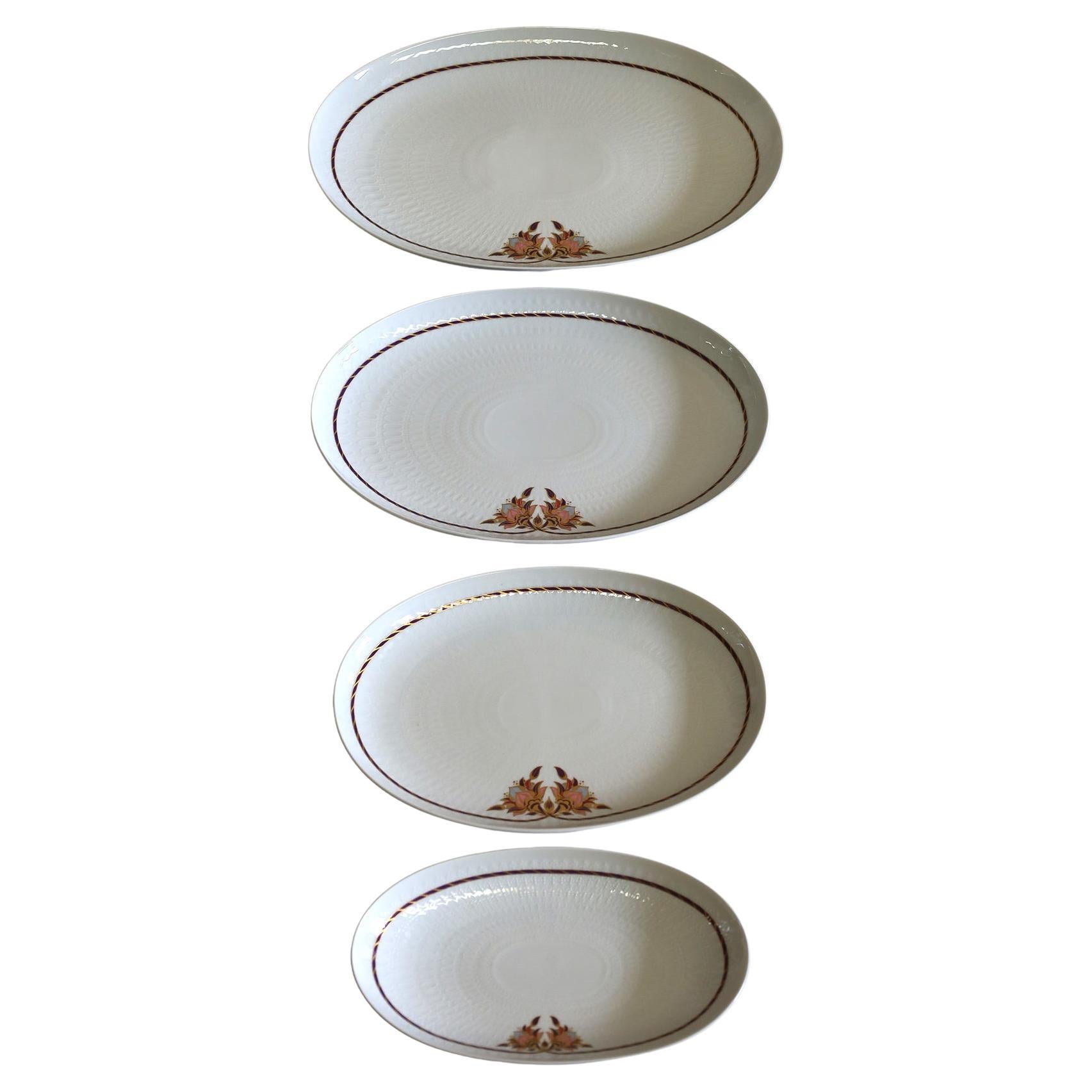 Set of 4 Vintage Rosenthal Classic Rose Platters, never used still with the Rosenthal paper tag.
Very elegant. 

Sizes:

38 x 26 cms
34 x 24 cms
29 x 20 cms
25 x 14 cms