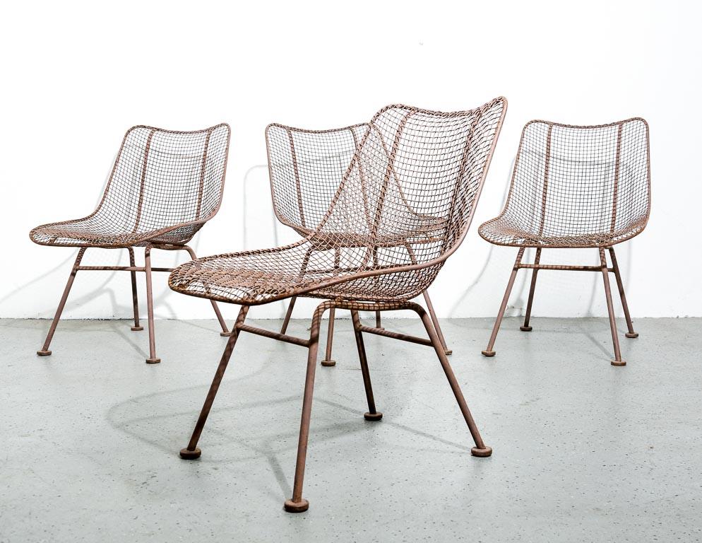 Set of 4 vintage 'Sculptura' patio low chairs in matte brown. All-steel construction with woven wire shell. 15