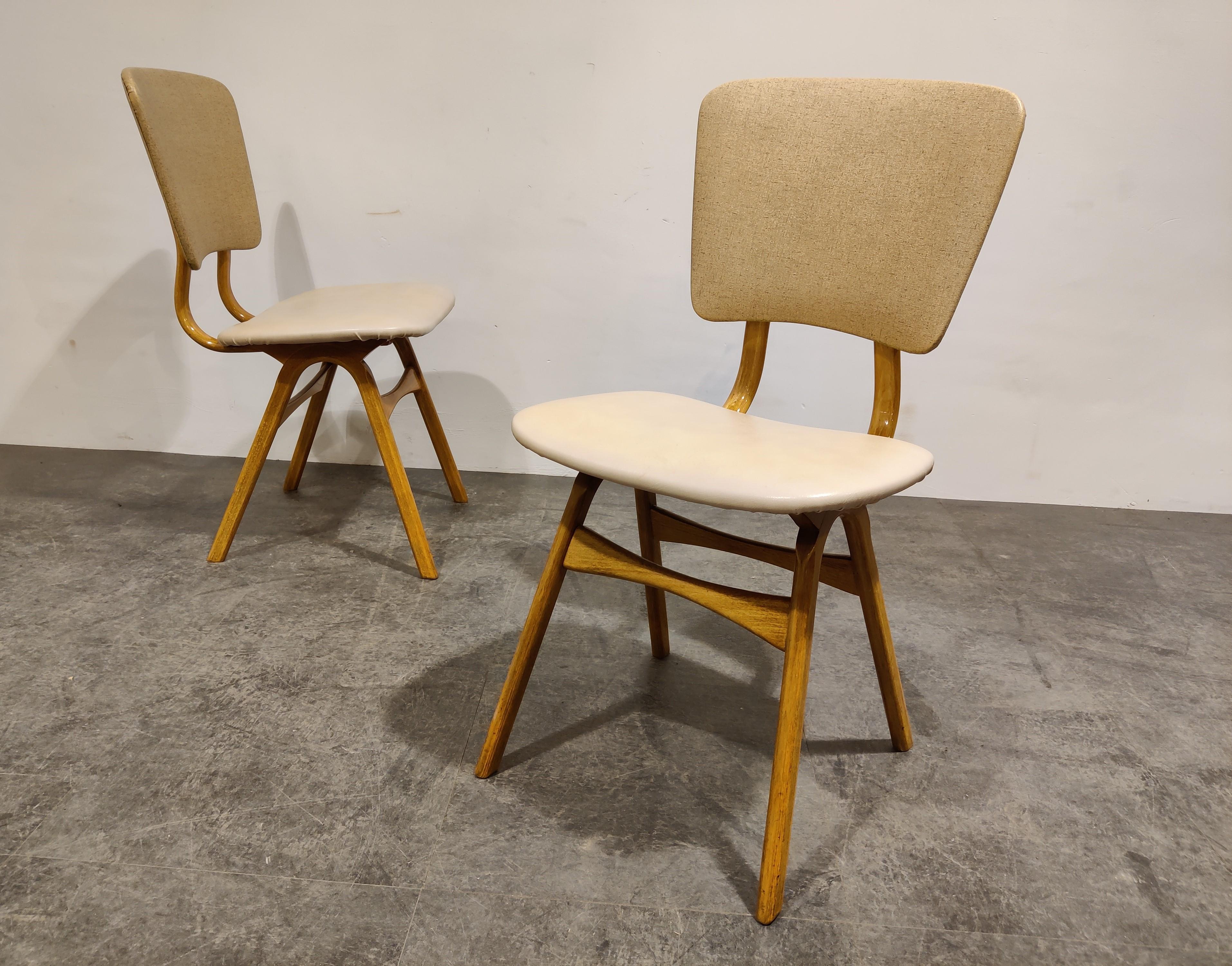 Mid century teak wooden dining chairs with original skai or faux leather upholstery.

Good condition.

The design resembles a lot of Louis Vanteeffelen.

Nice and elegant design,

1960s, Scandinavia

Measures: Height: 86cm/33.85
