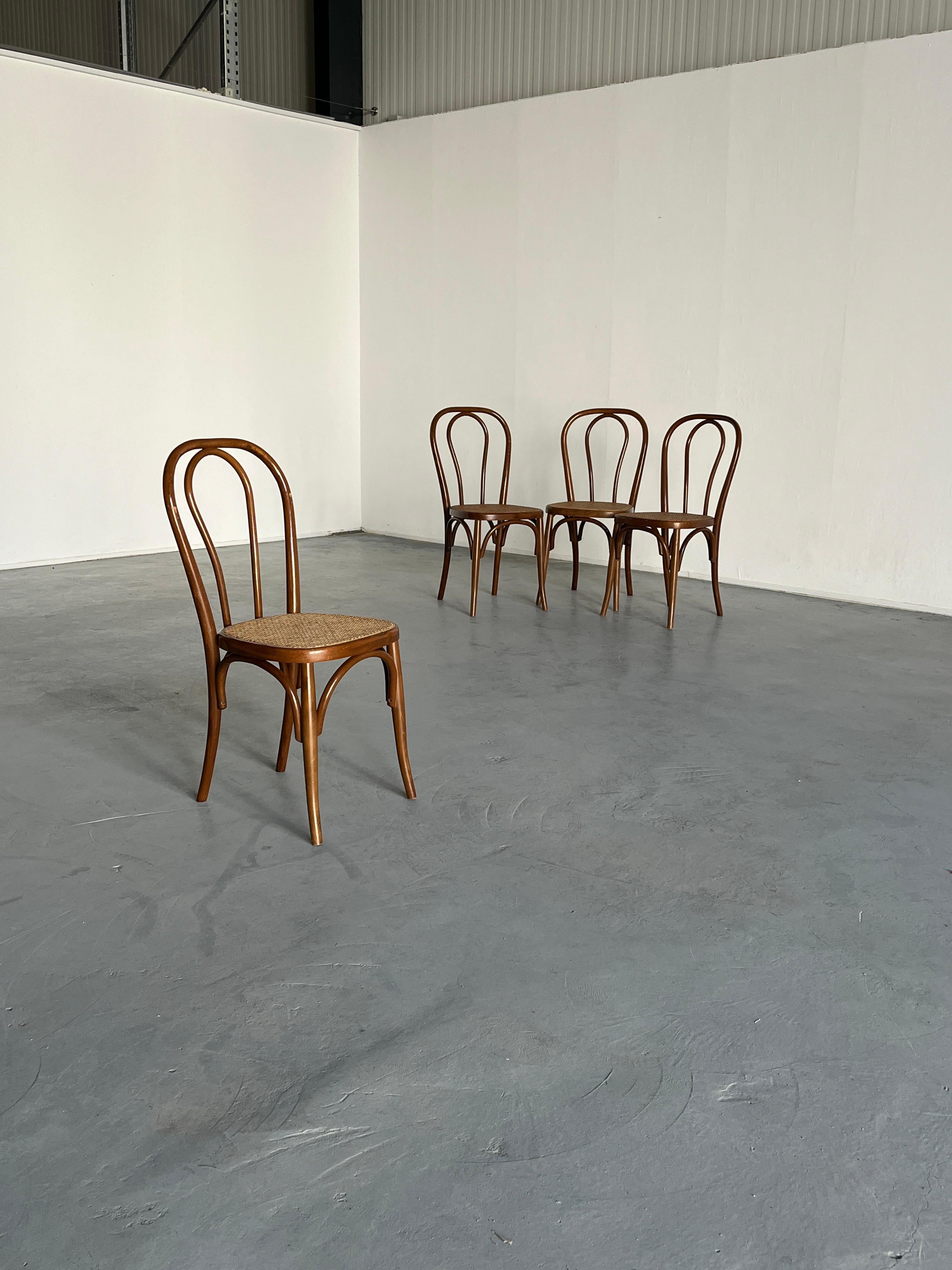 Set of four beautiful, wooden Thonet bentwood chairs, in style of the popular model no. 14.

Based on the dimensions, materials, weight and type of screw, they are most probably an original Thonet no. 14 chair produced by the Thonet Mundus factory