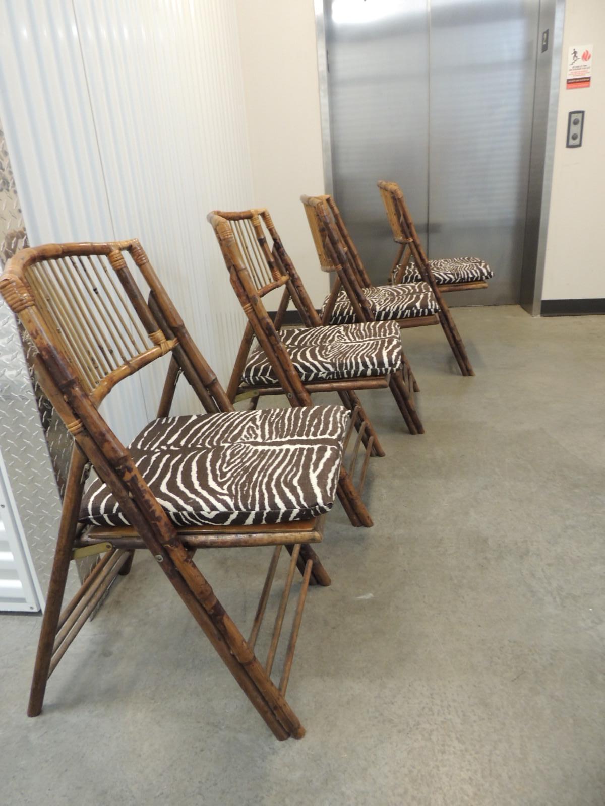 Set of (4) vintage tortoise bamboo and rattan folding chairs with seat cushions.
Bamboo set with Paolo Moschino For Nicholas Haslam for Lee Jofa
Fabric: Zebra in Brown and white (zipper closure seat cushions, double sided and foam filled.
Fabric: