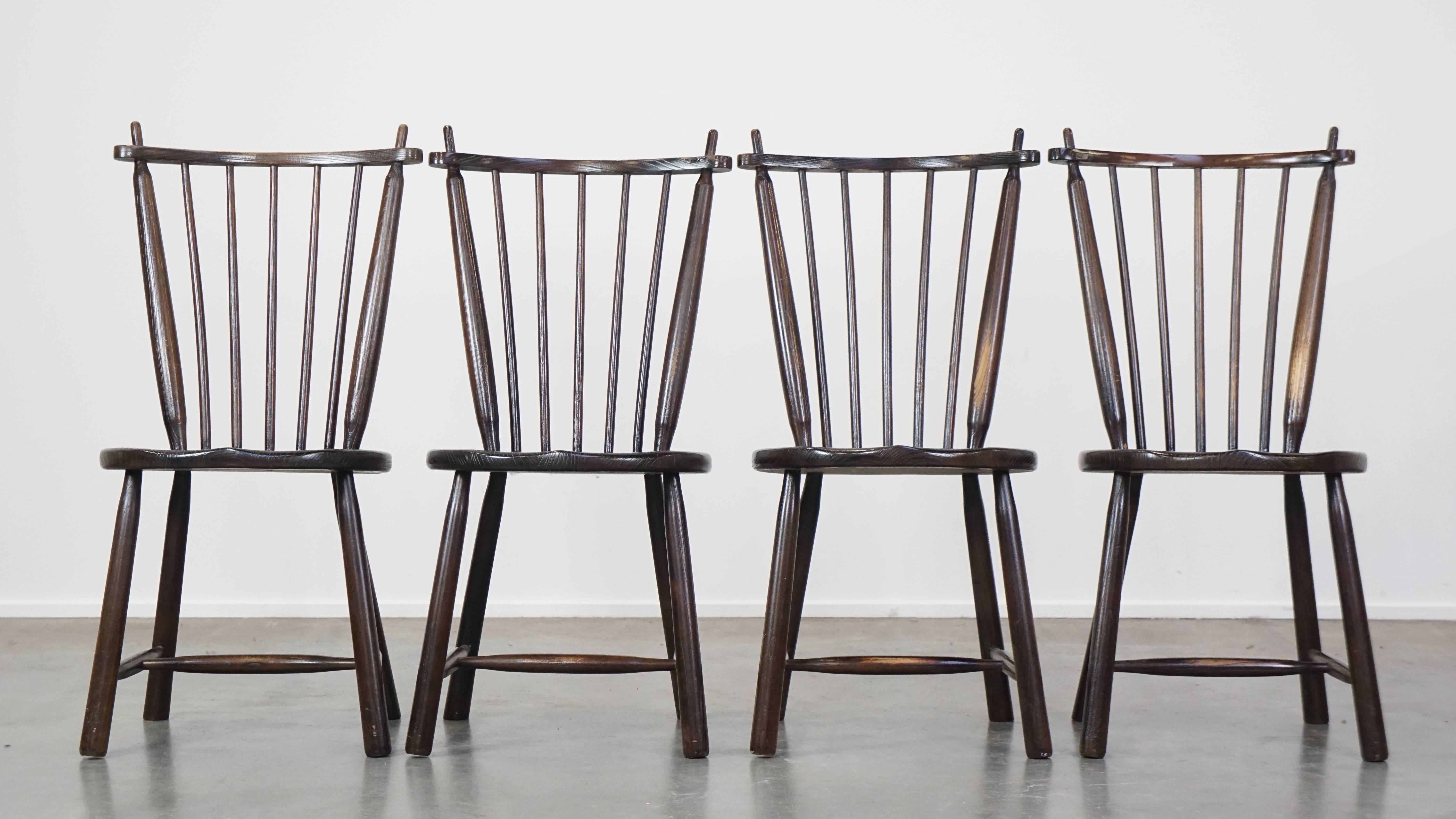 This set of 4 charming vintage spindle chairs is a beautiful addition to nearly any interior. You can place them at the dining table to enjoy meals with the family, or they would also look great in a coffee bar. Due to years of use, they have