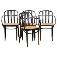 Set of 4 vintage wooden design dining/bistro chairs with woven seats
