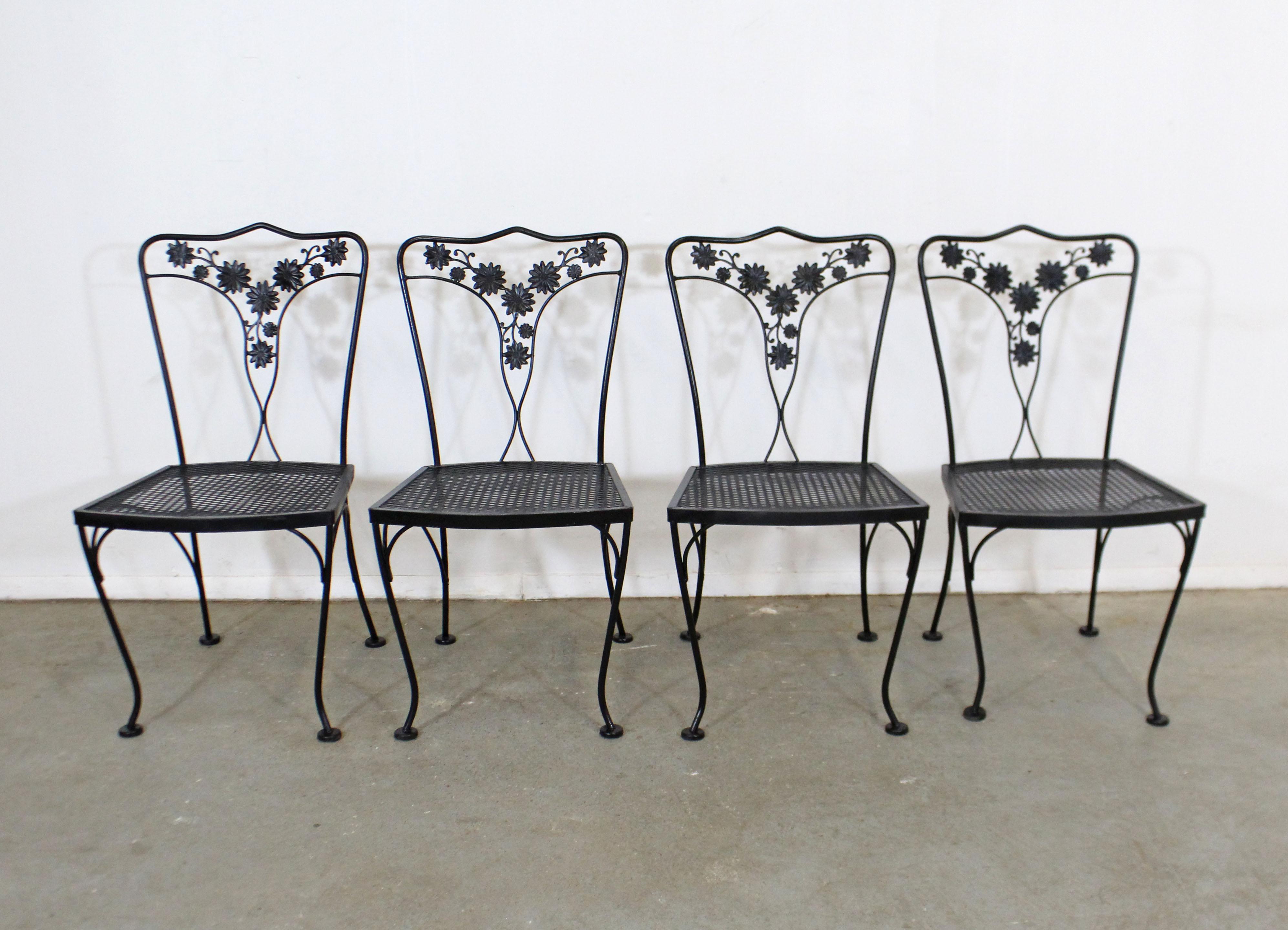 What a find. Offered is a set of 4 vintage wrought iron patio side chairs with floral designs on the backs, curved legs, and mesh seats. Perfect for an outdoor patio space! The chairs are in good condition with some age wear. Two chairs have a