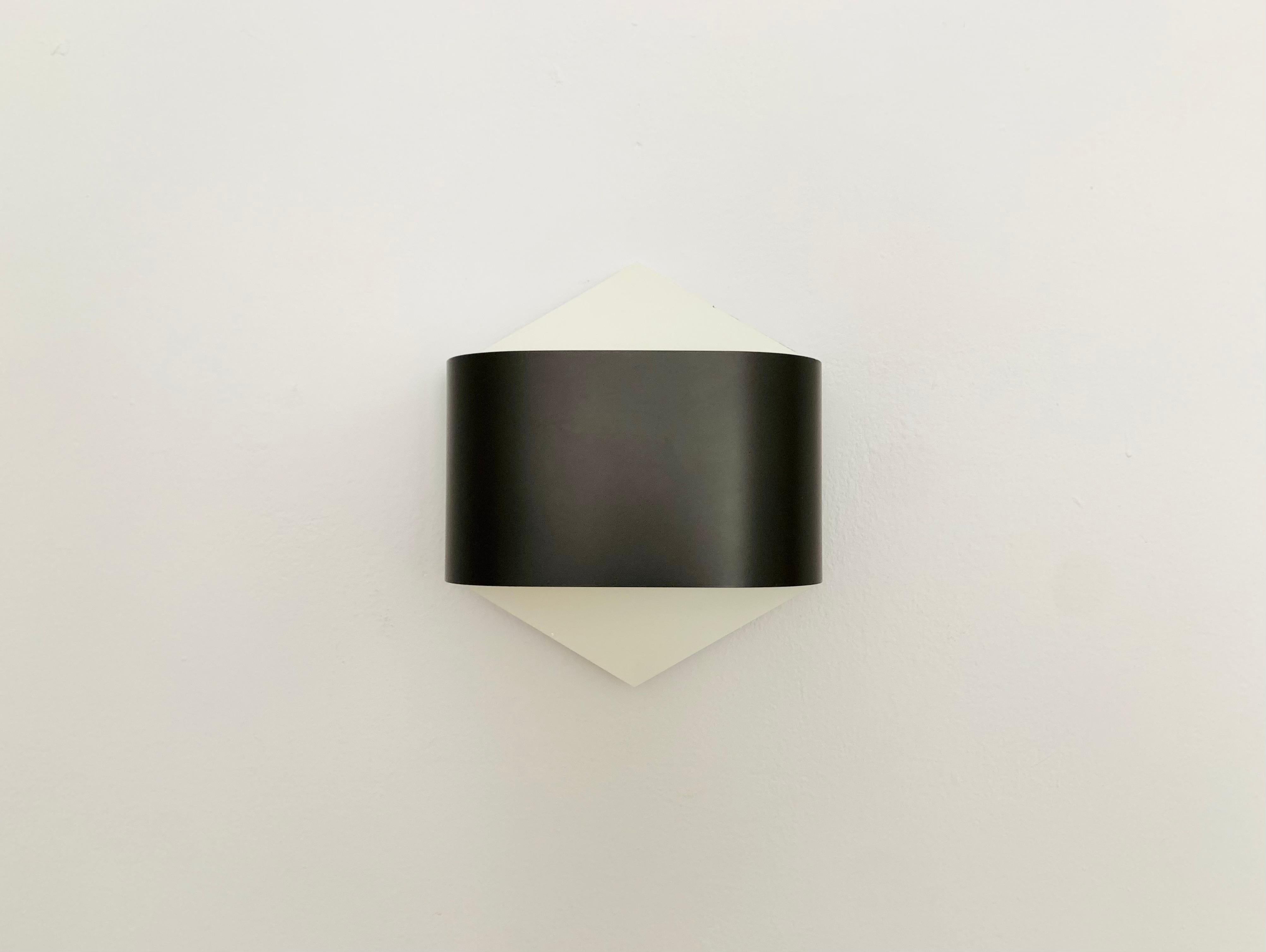 Fantastic wall lamp from the 1970s.
The Staff brand is known for its high-quality workmanship and design.
A wonderful play of light is created on the wall.

Design: R. Krüger and D. Witte
Manufacturer: Staff

The color outside is dark