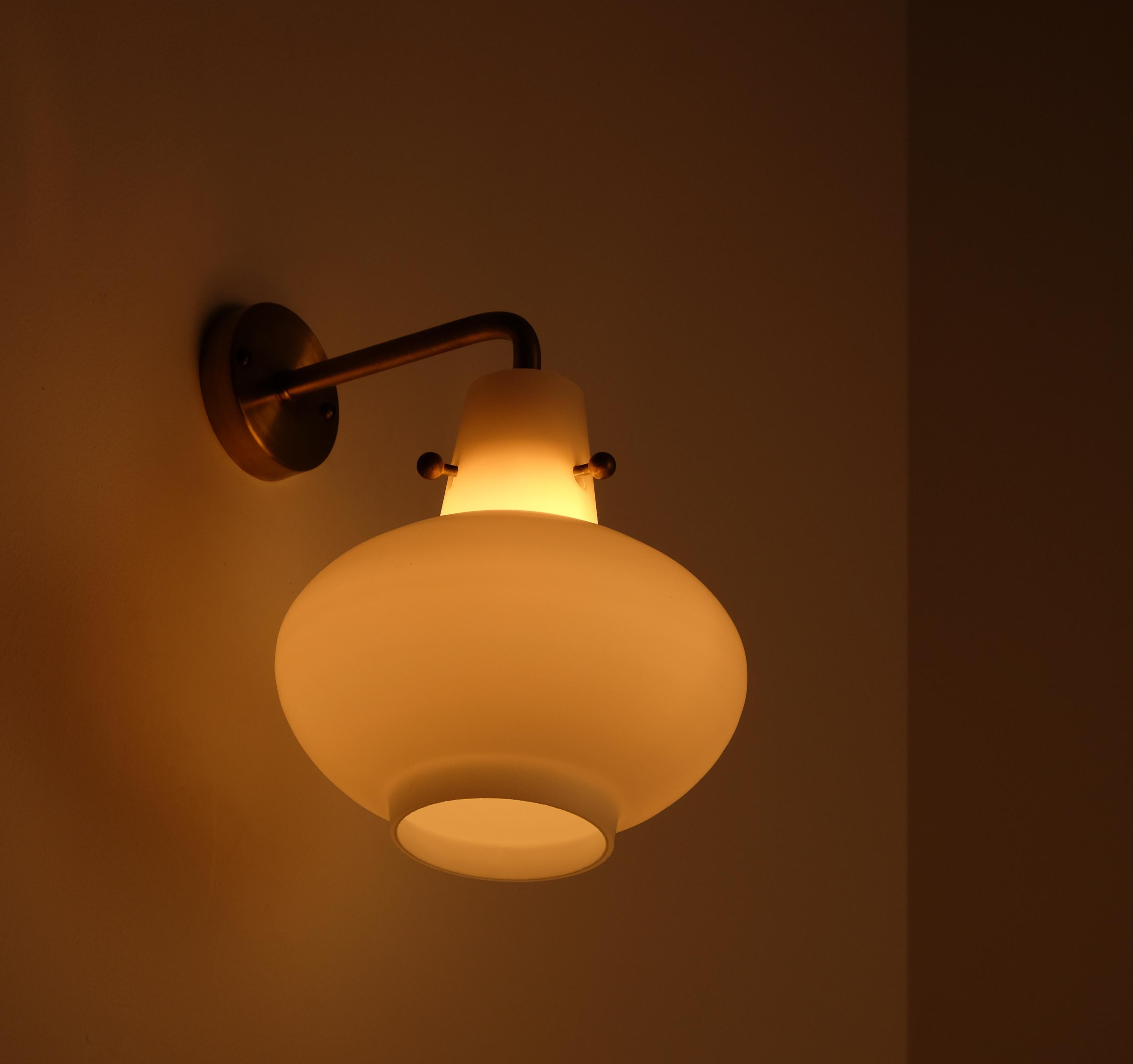 Model 407. Produced by Ateljé Lyktan, Åhus, Sweden.
Designed by Hans Bergström. Brass and opaline glass.

PLEASE NOTE: Listed price is for a single wall light.

 