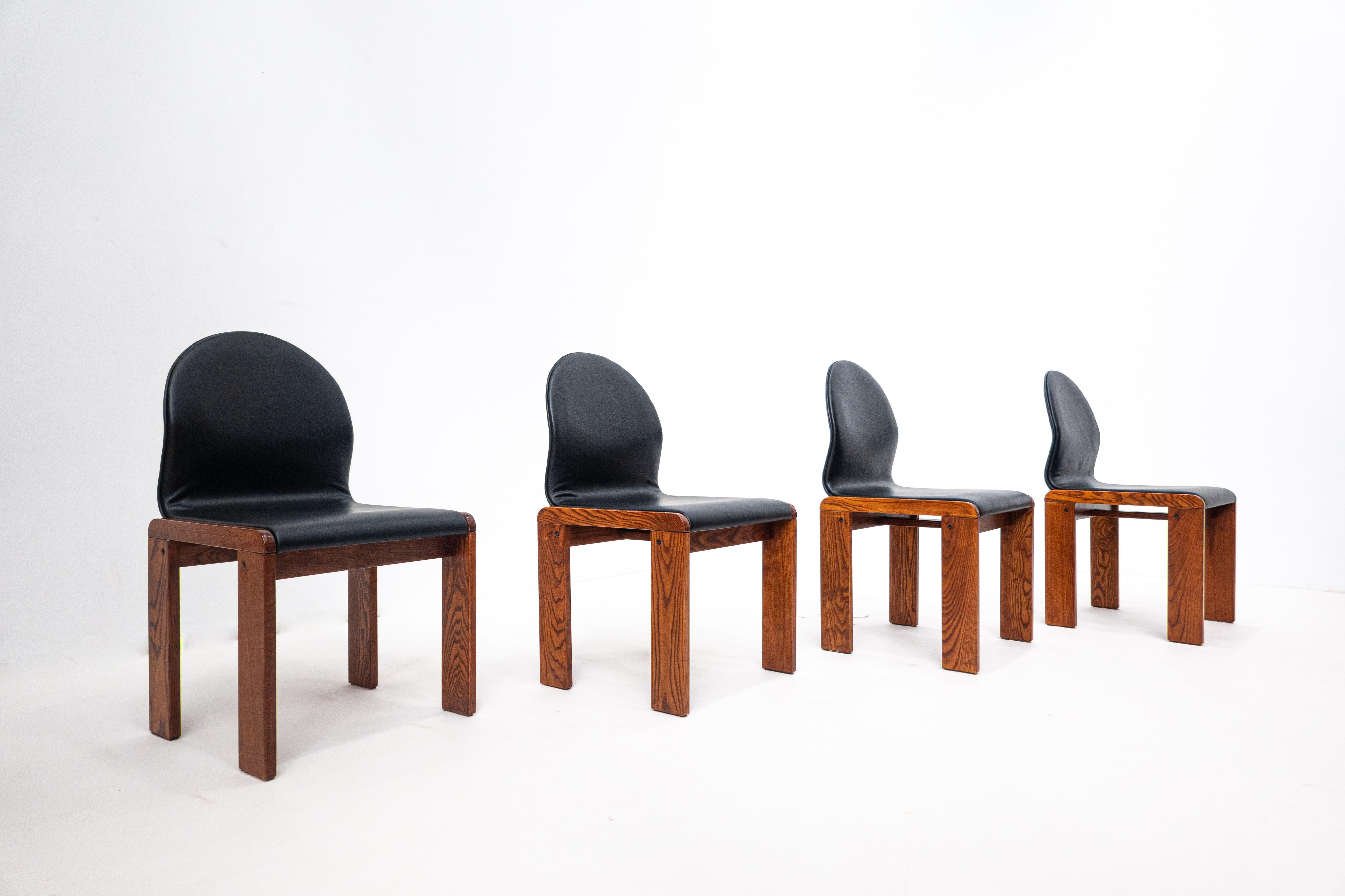Set of 4 walnut and leather chairs by Afra and Tobia Scarpa, Italy, 1970s.