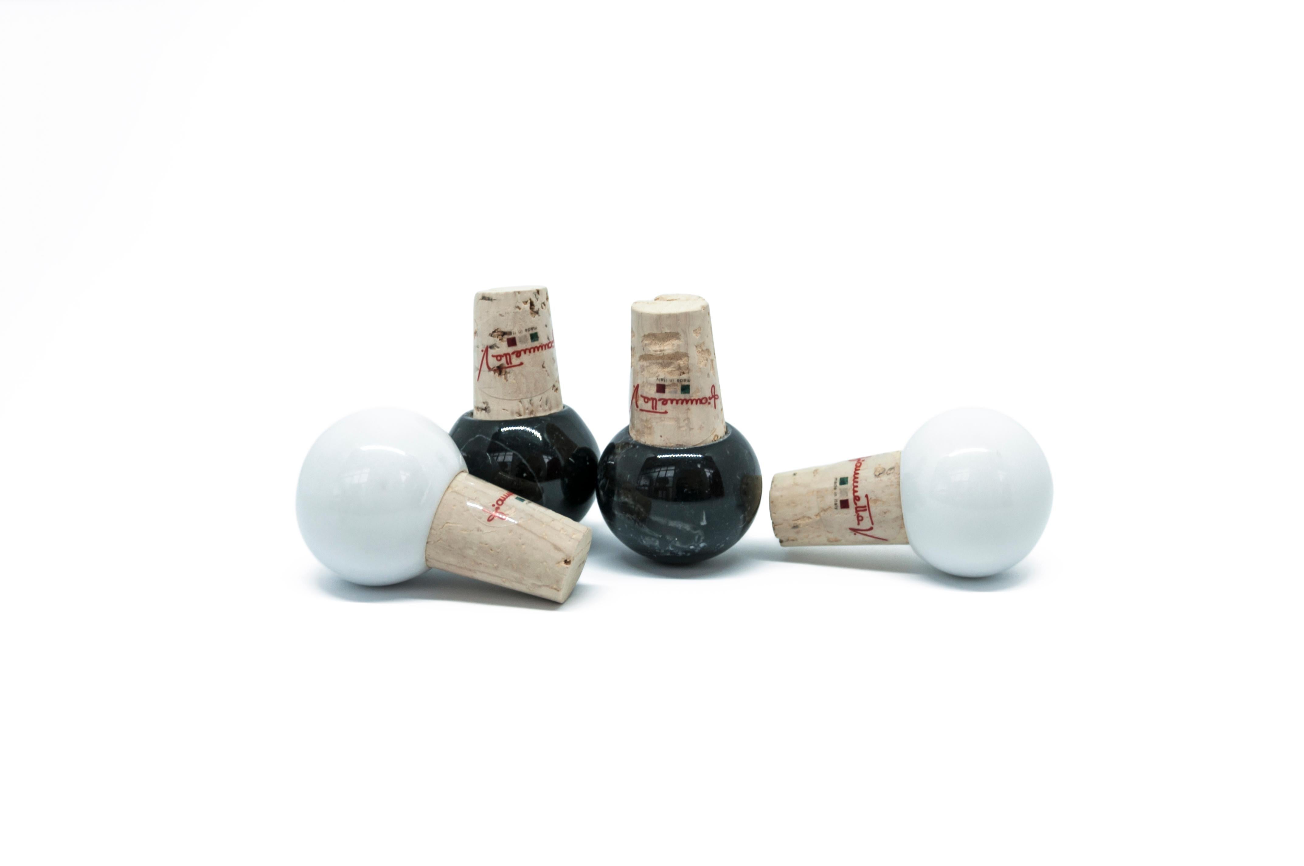 Set of 4 bottles stoppers in marble and cork (2 in white Carrara marble and 2 in black Marquina), ideal for glass bottles of oil and wine.

Each piece is in a way unique (since each marble block is different in veins and shades) and handcrafted in
