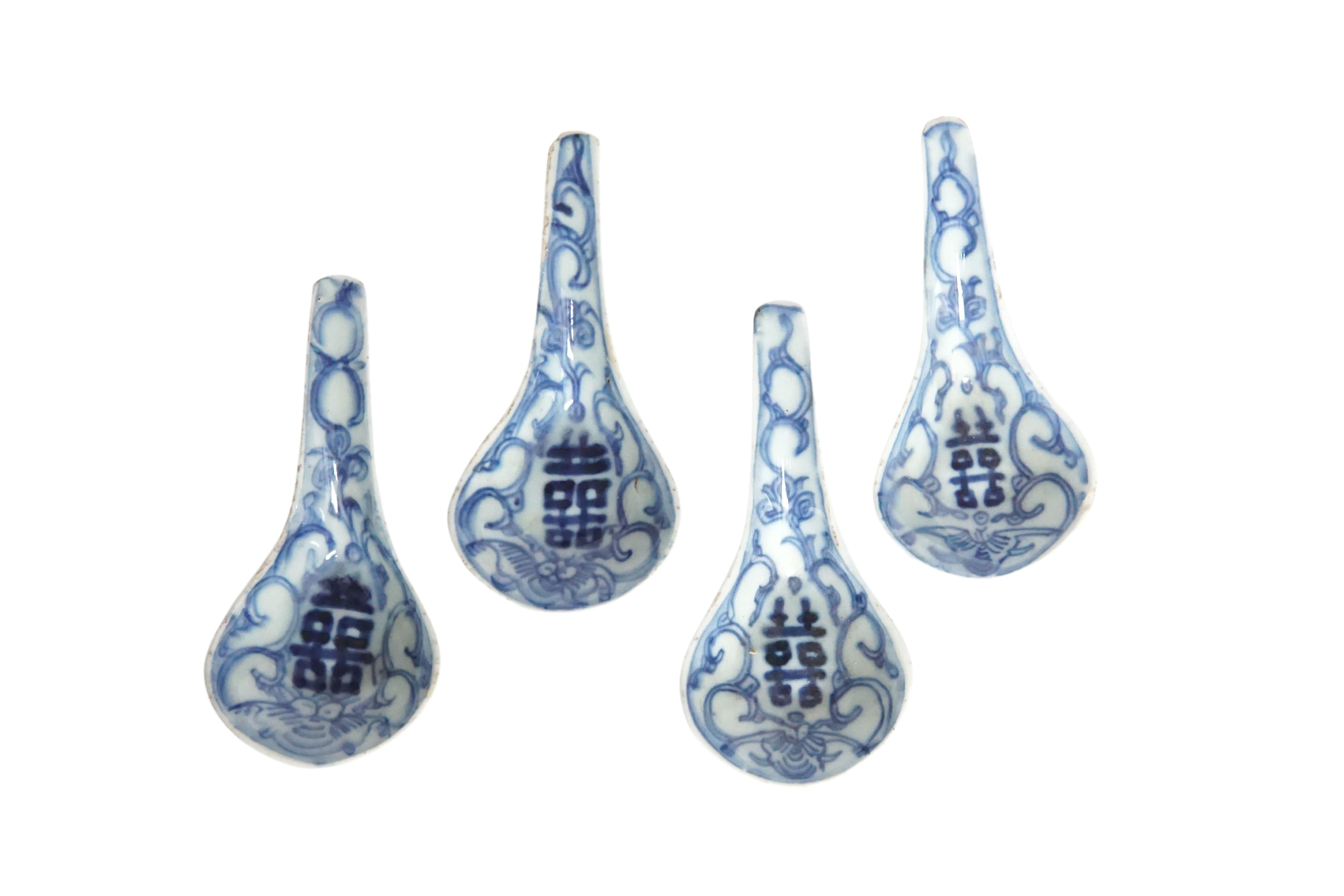 A wonderfully hand-painted set of 4 Chinese blue & white ceramic spoons circa 1850. They bear double happiness signs and wonderful, sculptural shape. A great piece of Chinese History. 
 