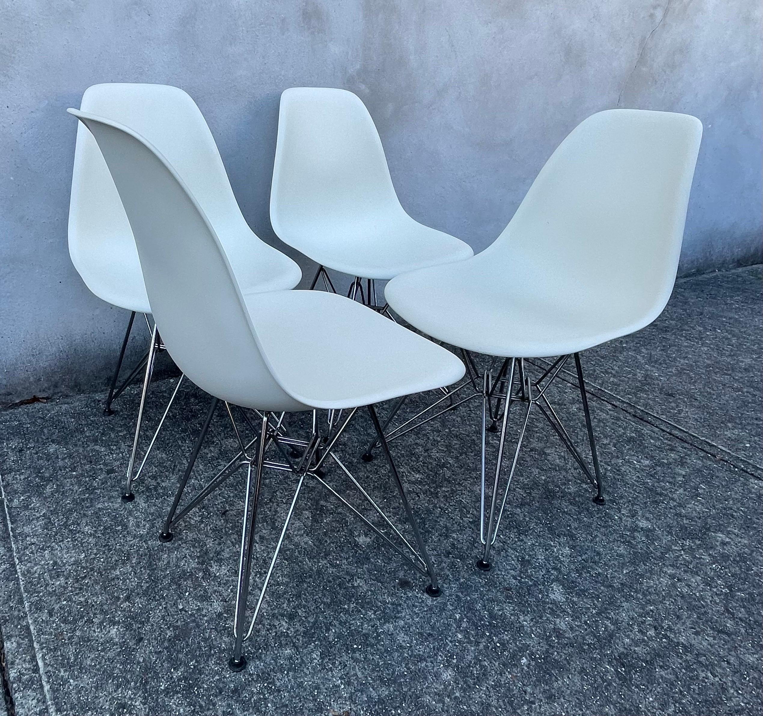Set of 4 White Eames DSR Dining Chairs with Chromed Steel Eiffel Base, 2010 In Good Condition In Bedford Hills, NY