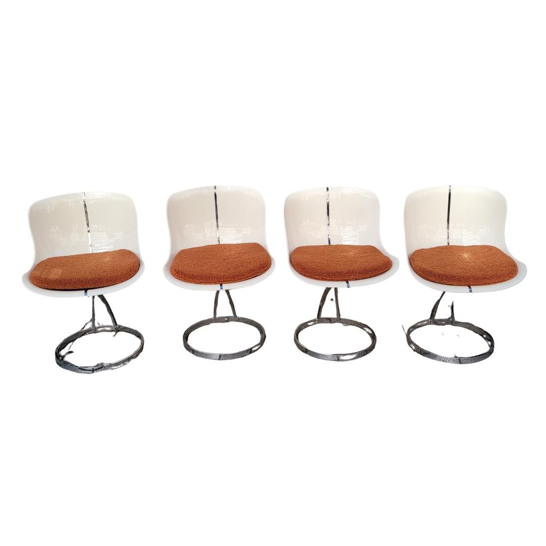 
Amazing and Gorgous set of four Goldfinger chairs, made of  white fiberglass with chrome-plated steel legs, and a tile-colored upholstered cushion with thick boucle. Its design is inspired by the works of Michel Cadestin (1942–), designer of the
