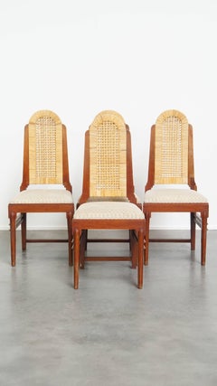 Set of 4 wooden Art Deco design dining chairs with a wicker seat and backrest