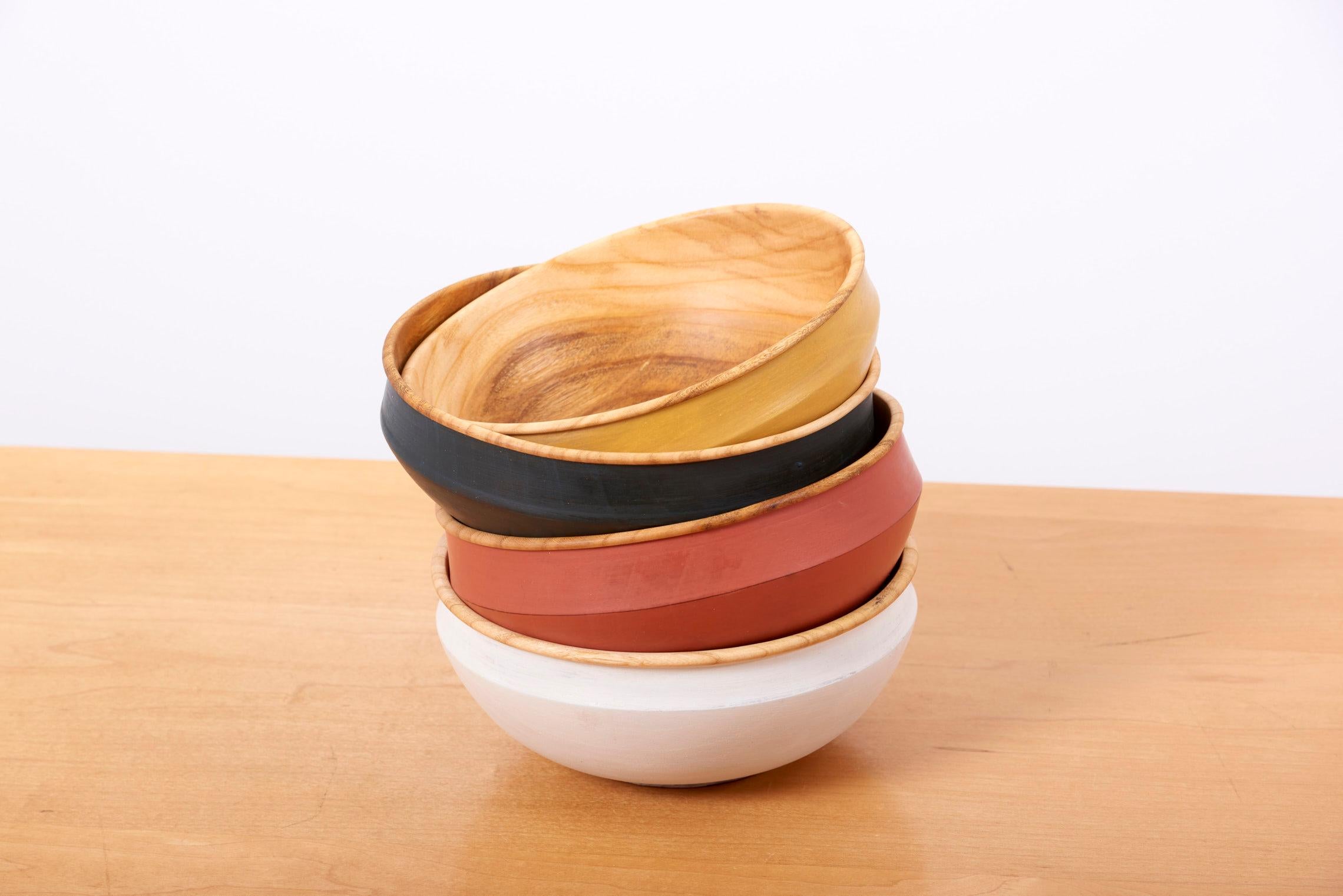 Set of 4 different colored handcrafted wooden bowls by Fabian Fischer, Germany, 2020. Made of beechwood with milk paint outside.