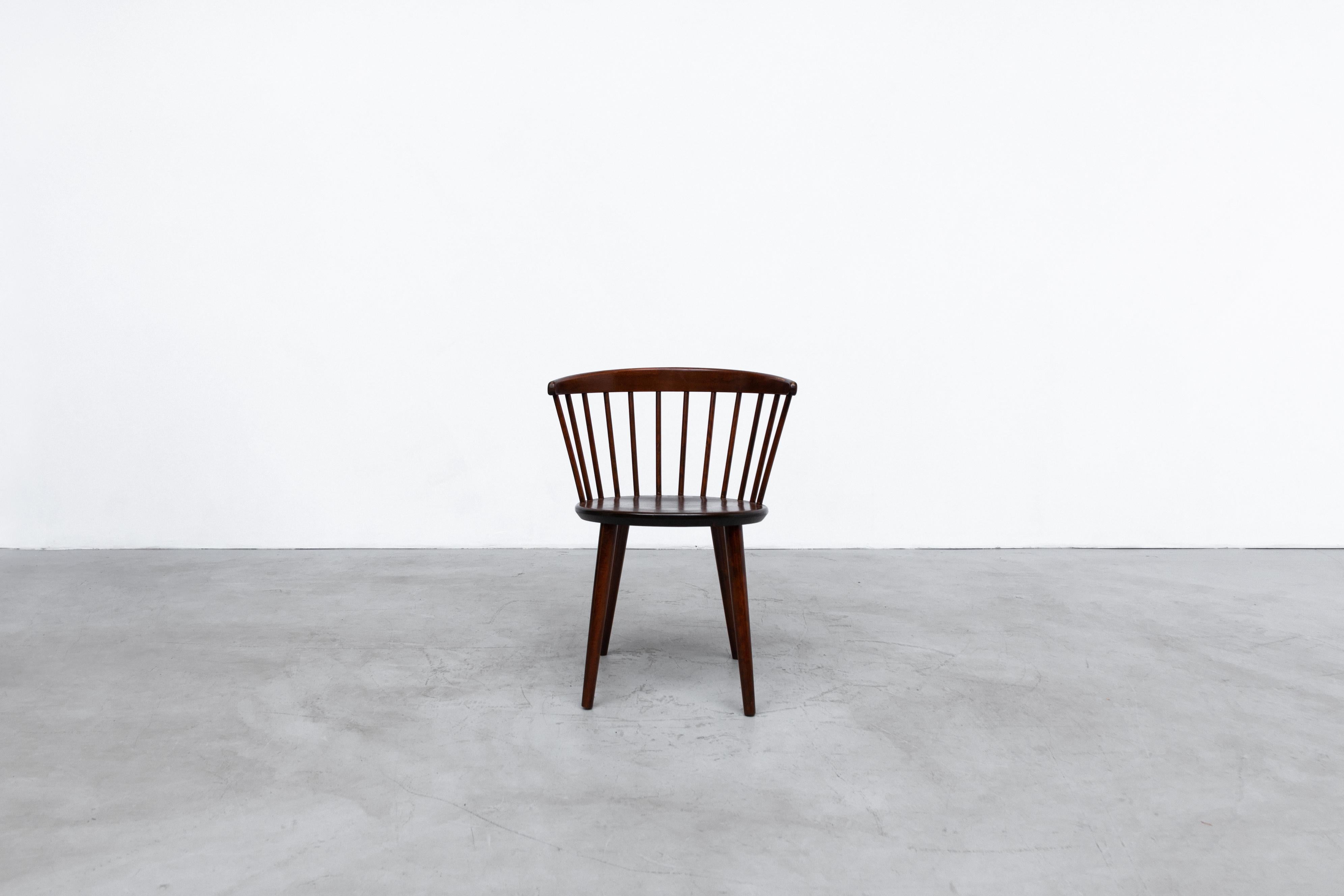 Set of 4 Yngve Ekstrom, Model V9 dark stained spindle back chairs for Nesto. Lightly refinished with curved back, tapered legs and wide seat rest. In original condition with some visible wear consistent with age and use. Set price. Single also