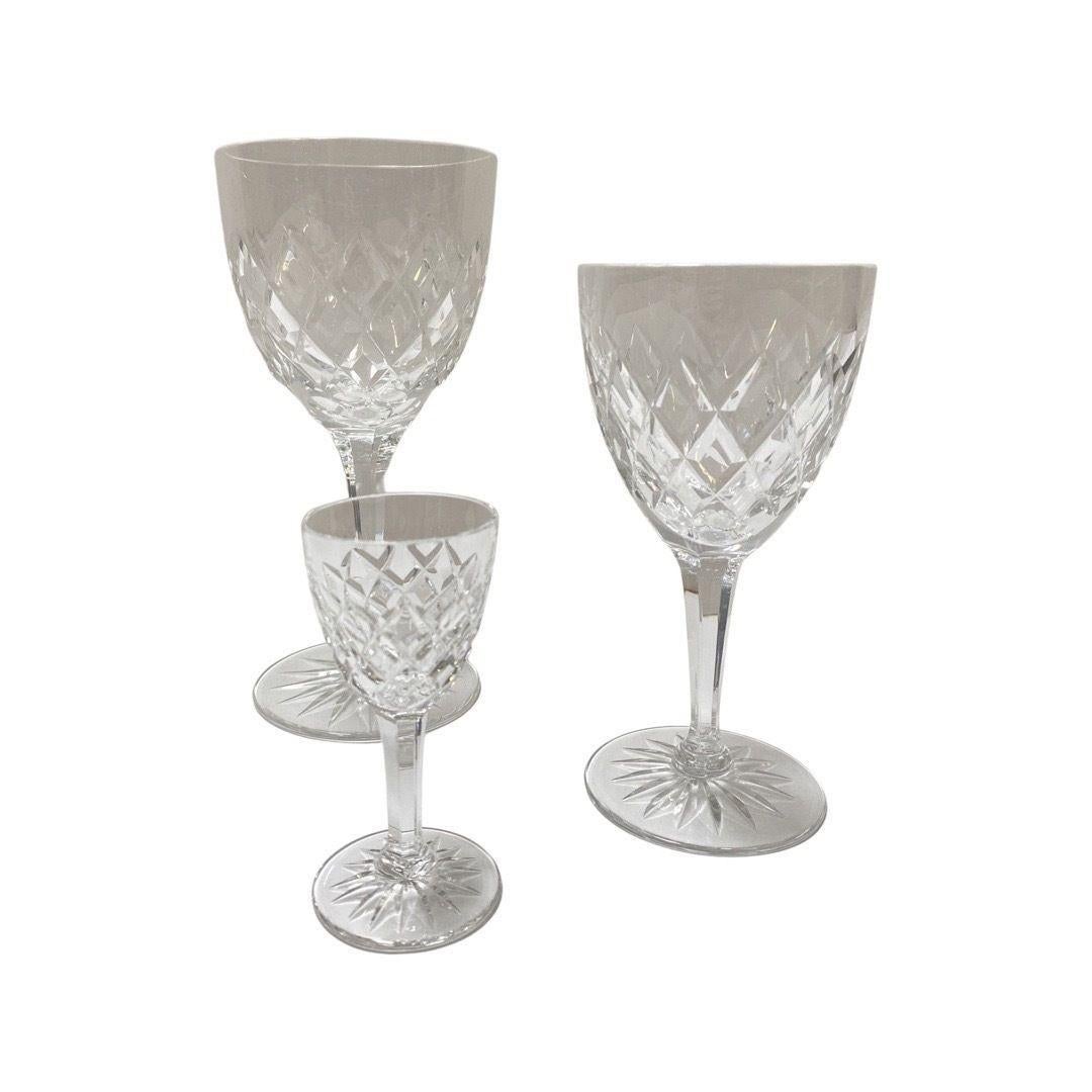A set of Post War Waterford champagne, wine, and liquor glasses.
The Set consists of 
10 small liquor glasses
6 medium wine glasses
12 large wine glasses
12 champagne or cocktail glasses.