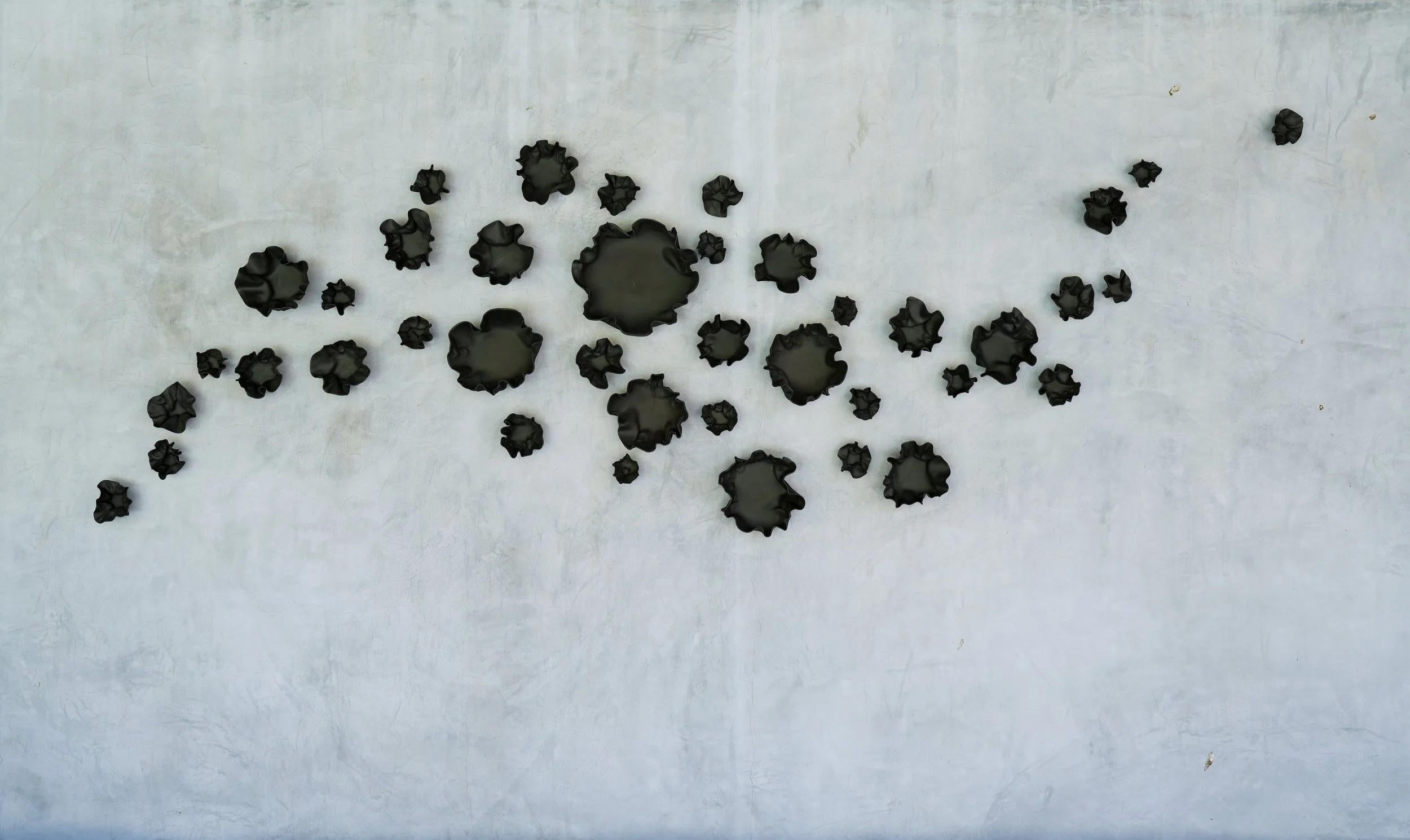 Set Of 40 Wall Sculpture in Matte Black Porcelain by Natalya Sevastyanova
Dimensions: L 198 x H 106 cm.
Materials: Porcelain.

Based in, produced, and shipped from the US. Available in four different color options: White, Platinum, Bronze, Charcoal,