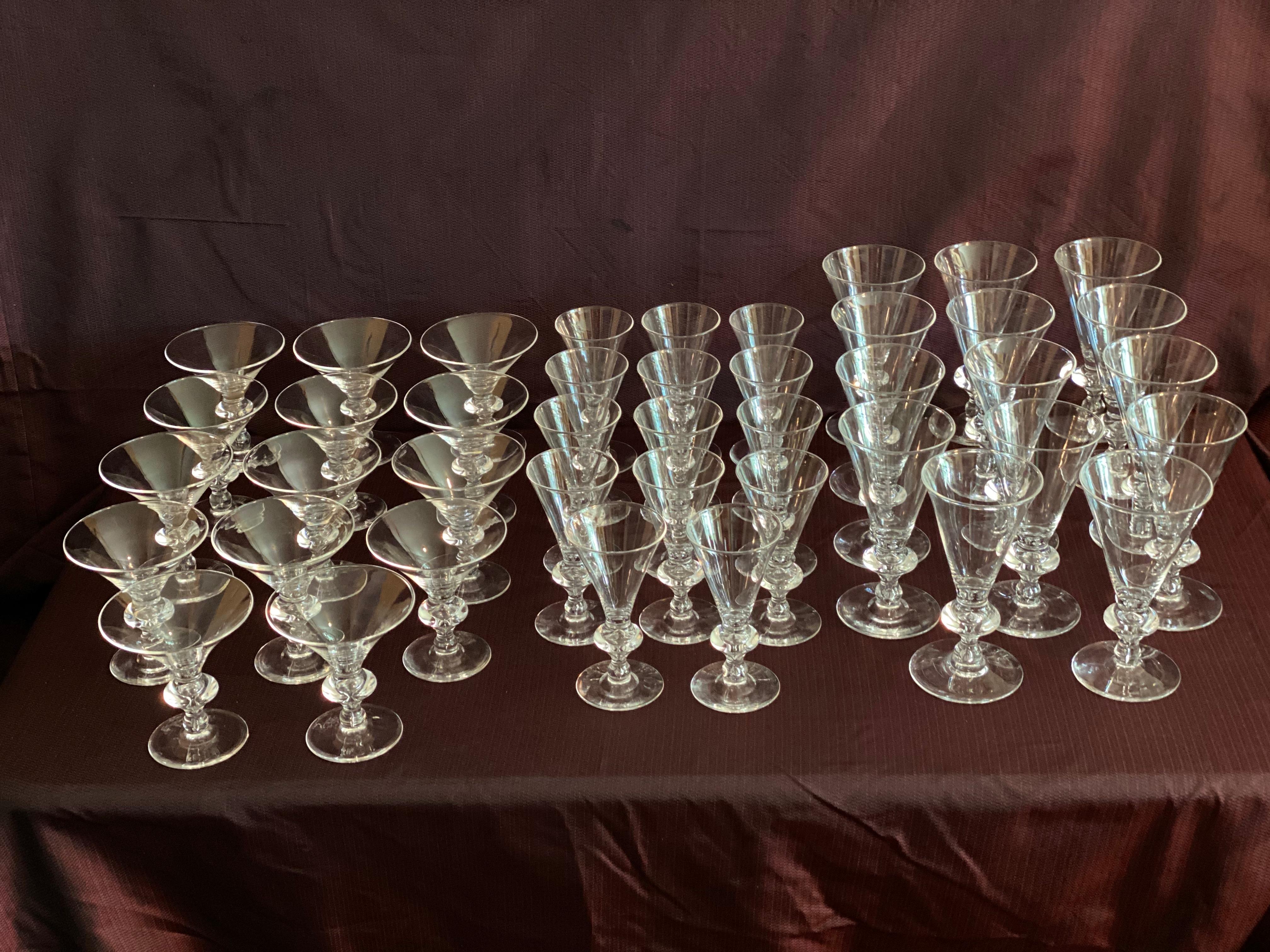 A set of 42 glasses, 14 red wine, 14 white wine, 14 martini glasses, all in perfect condition,
all signed in diamond script on bottom of base.