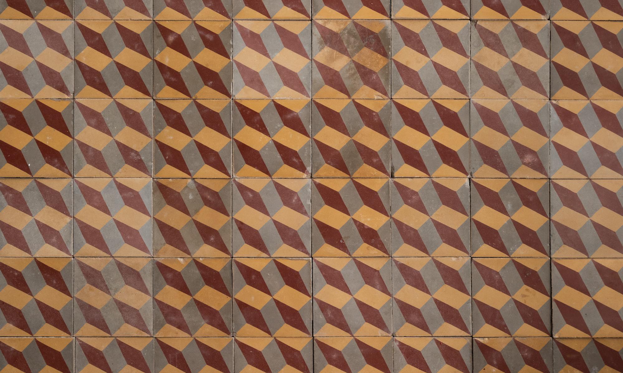 Set of (48) geometric pattern floor tiles, Europe, circa 1900.

Graphic and beautifully patinated tiles with three-color optical illusion motif.