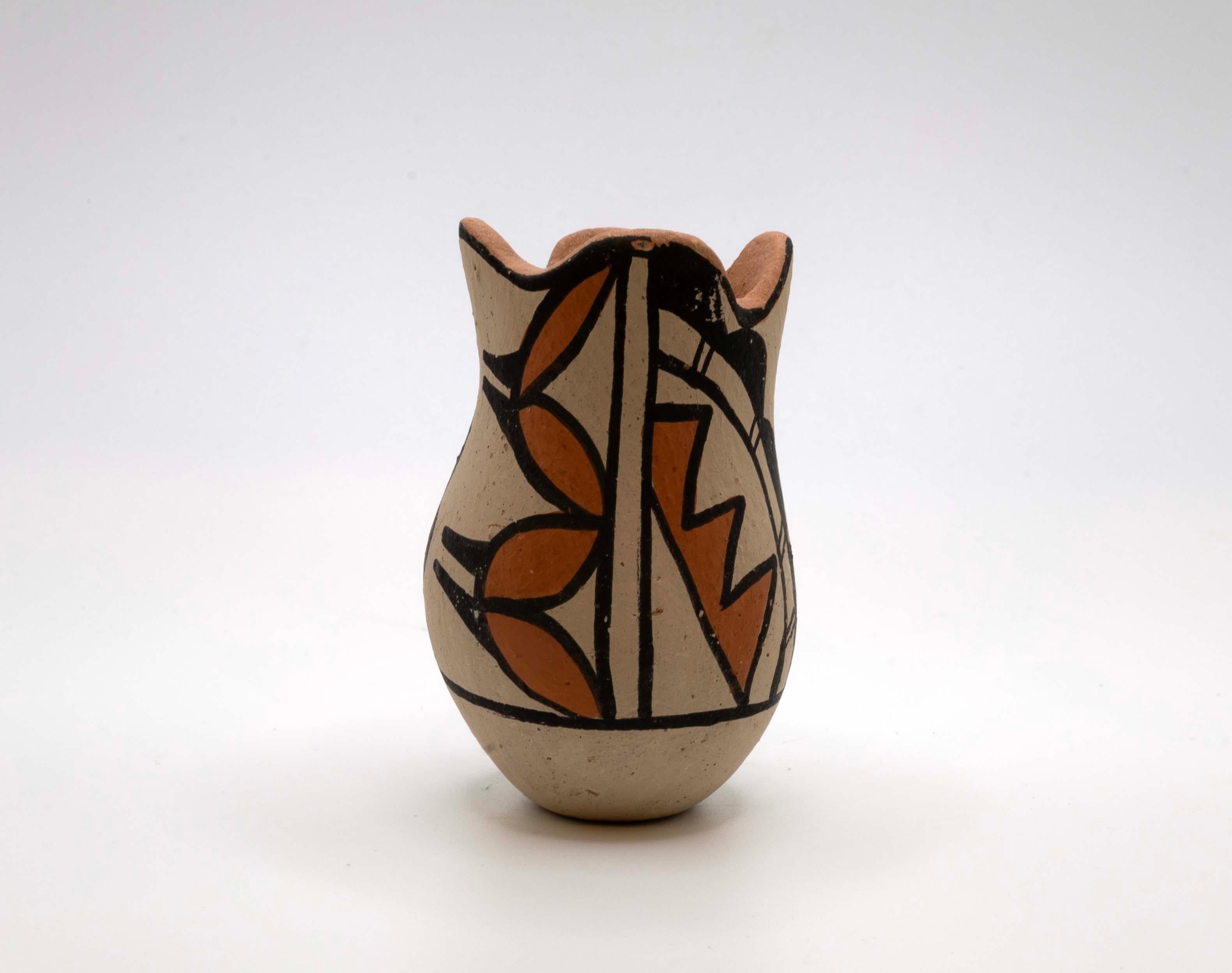 A traditional set of Pueblo Acoma & Jemez pottery from New Mexico. Each vessel is signed – D. Reano (Dean Reano) and Jemez (unknown). The vessels are fired earthenware with highly stylized geometric designs in stark black and white. Acoma and Jemez