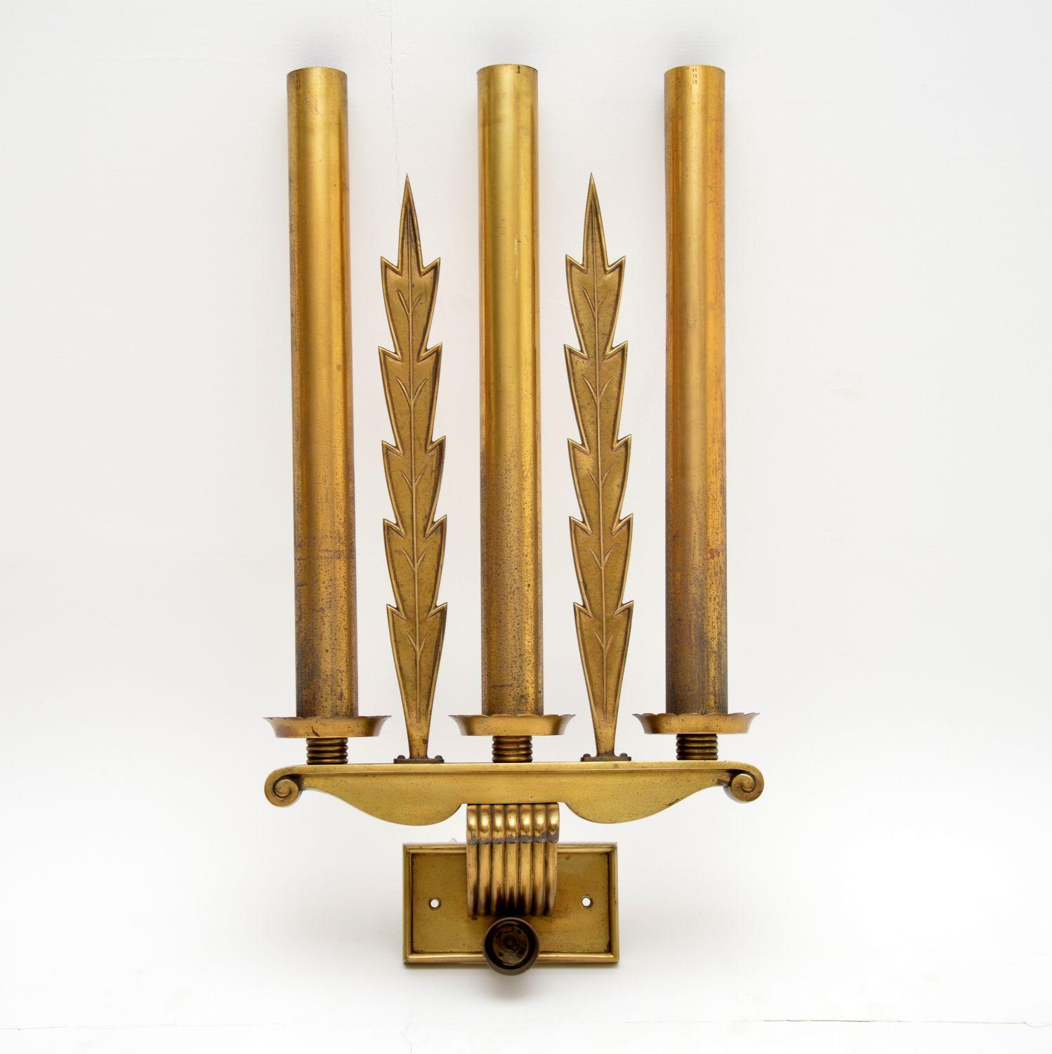 Set of five very stylish large antique neoclassical brass wall lights in good original condition and showing natural wear to the brass. You can only see four in the group image, but there are five. They are very unusual and I’ve never come across
