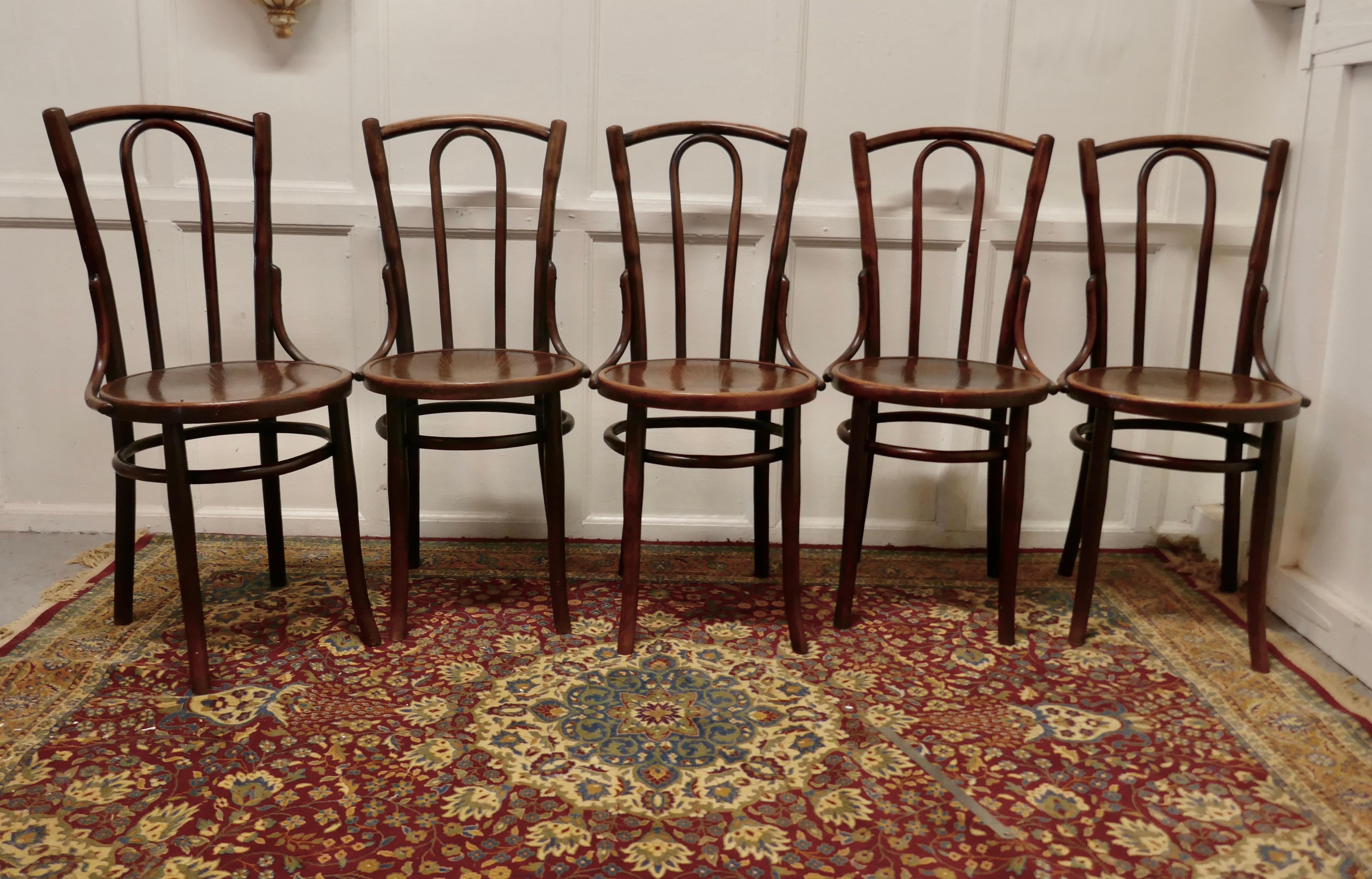 Set of 5 bistro bentwood chairs by Mazowia

A good sturdy set of 5 café chairs, traditionally this type of chair was used in Bistros and Brassieres but they would make just as good kitchen chairs 
The chairs have pressed plywood seats with hooped