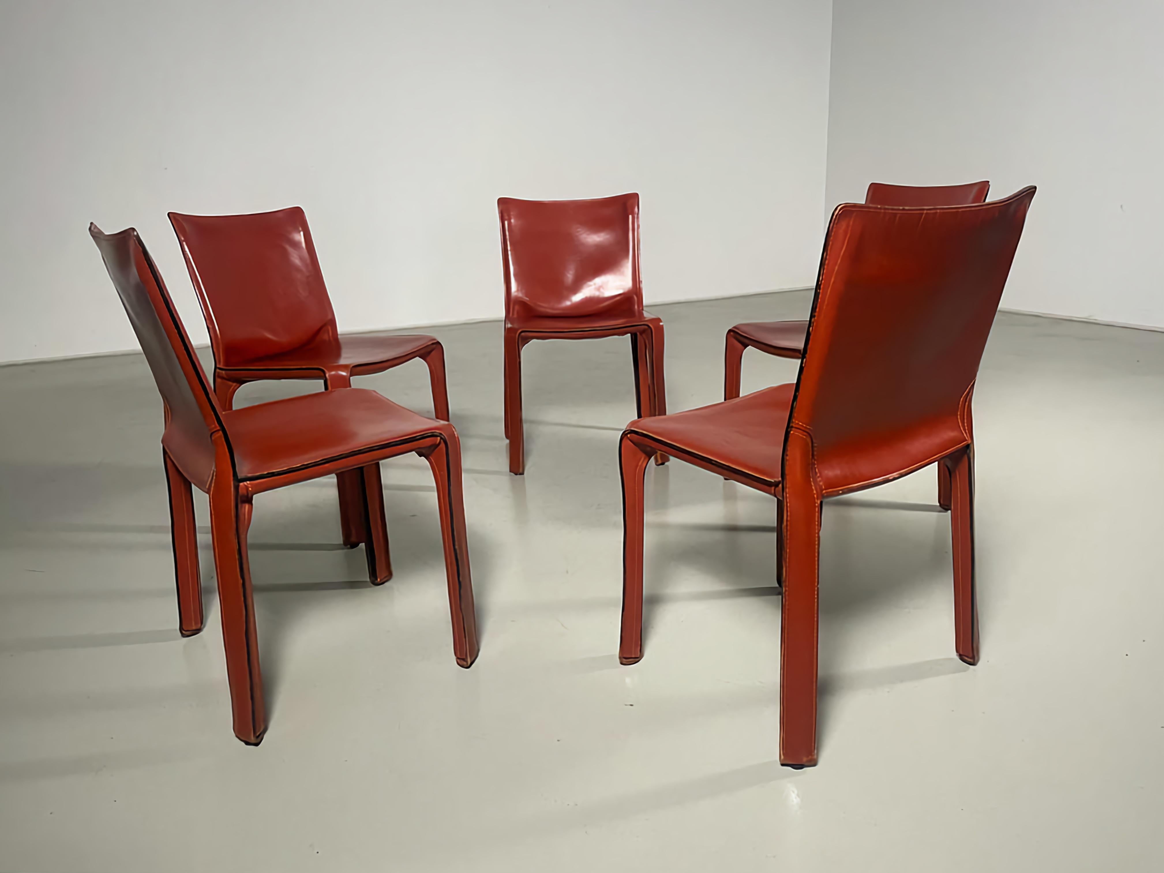 Cassina CAB 412 chairs, Mario Bellini, Cassina, 1980s.

Set of 5 Taxi-412 dining room chairs in saddle leather. Designed by Mario Bellini and manufactured by Cassina in the 1980s in Italy. The leather cover is stretched over a minimal tubular steel