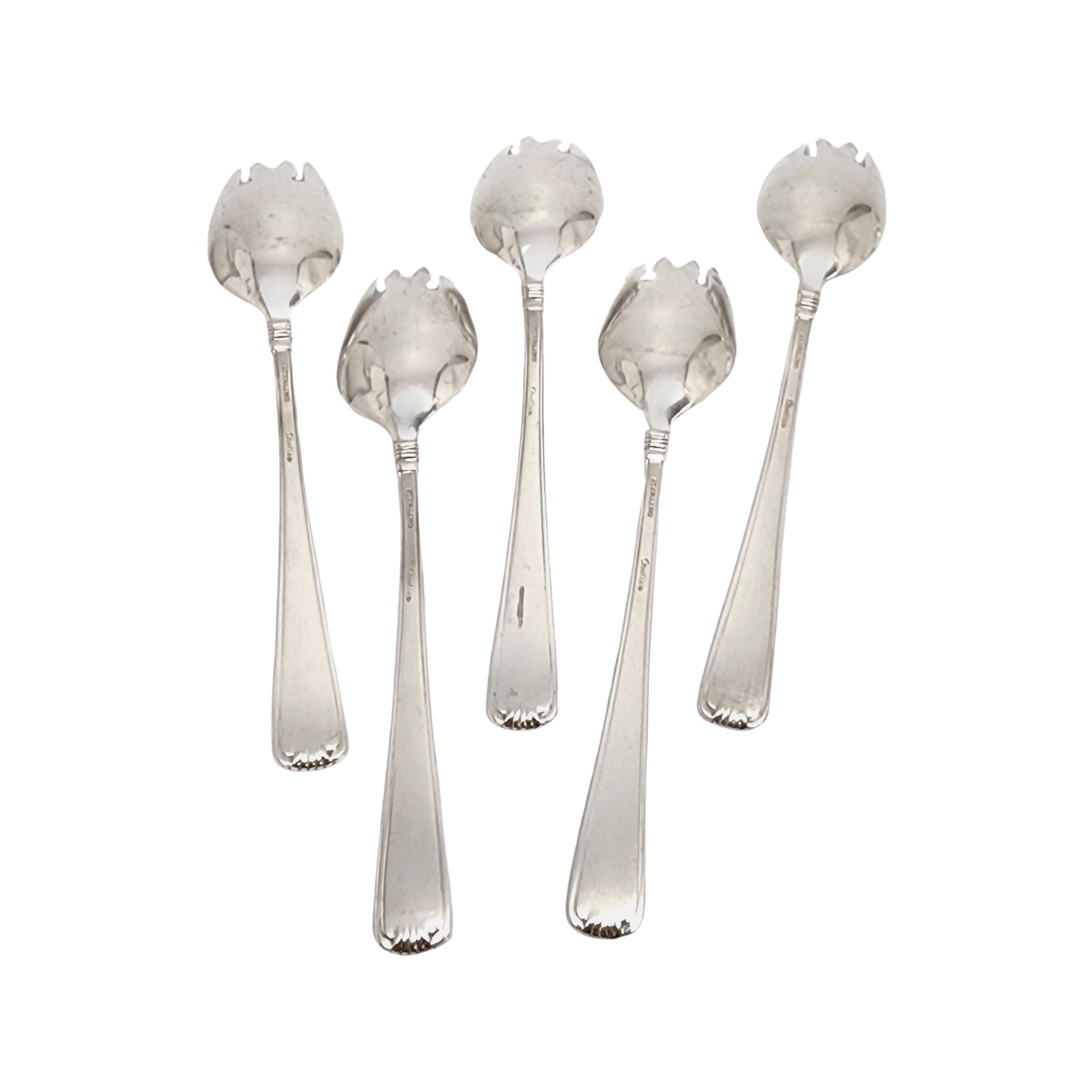 Set of 5 sterling silver ice cream forks in the Marie Louise pattern by Cartier with monogram.

Monogram appears to be D

Cartier's Marie Louise pattern features a simple and timeless scroll design with ribbed edging. These ice cream forks feature a