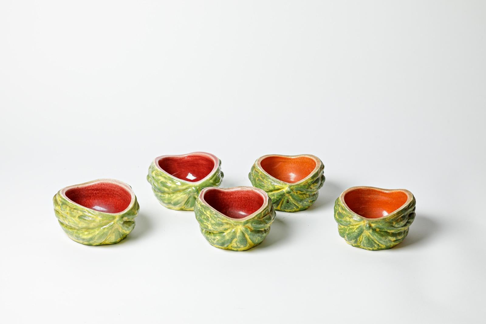 Pol Chambost

Signed MADE IN FRANCE and documented in the famous book Pol Chambost, sculpteur-céramiste, 1906 - 1983

Set of 5 ceramic dishes or vide poche 

Green, orange and red ceramic glazes colors

All in original perfect conditions

Height 7
