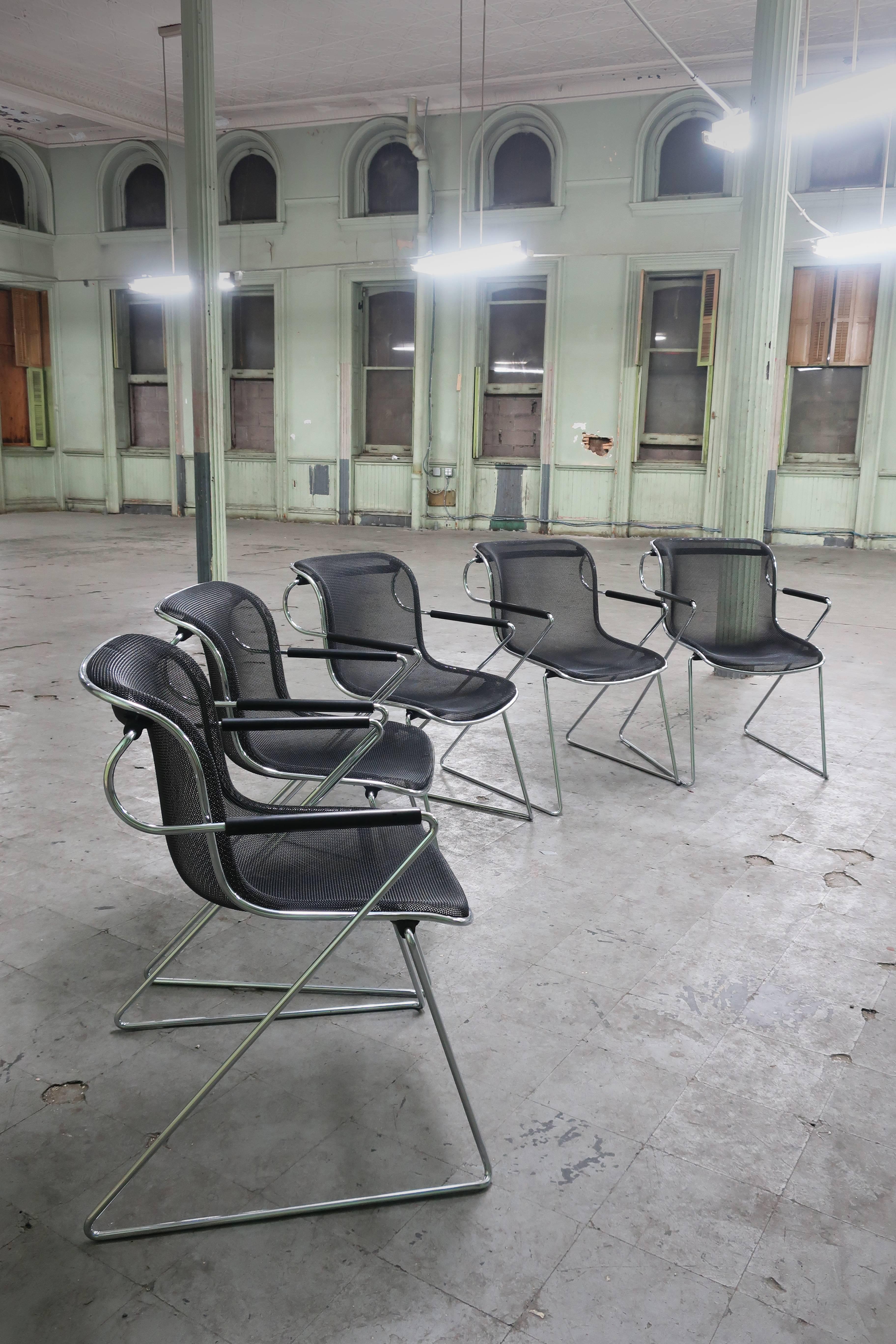 Set of five Penelope chairs designed by Charles Pollock for Castelli (1982). Constructed of chrome arms and legs with a steel wire sled seat sitting on a polyurethane shock absorbing tube, this design Classic is comfortable, has a beautiful