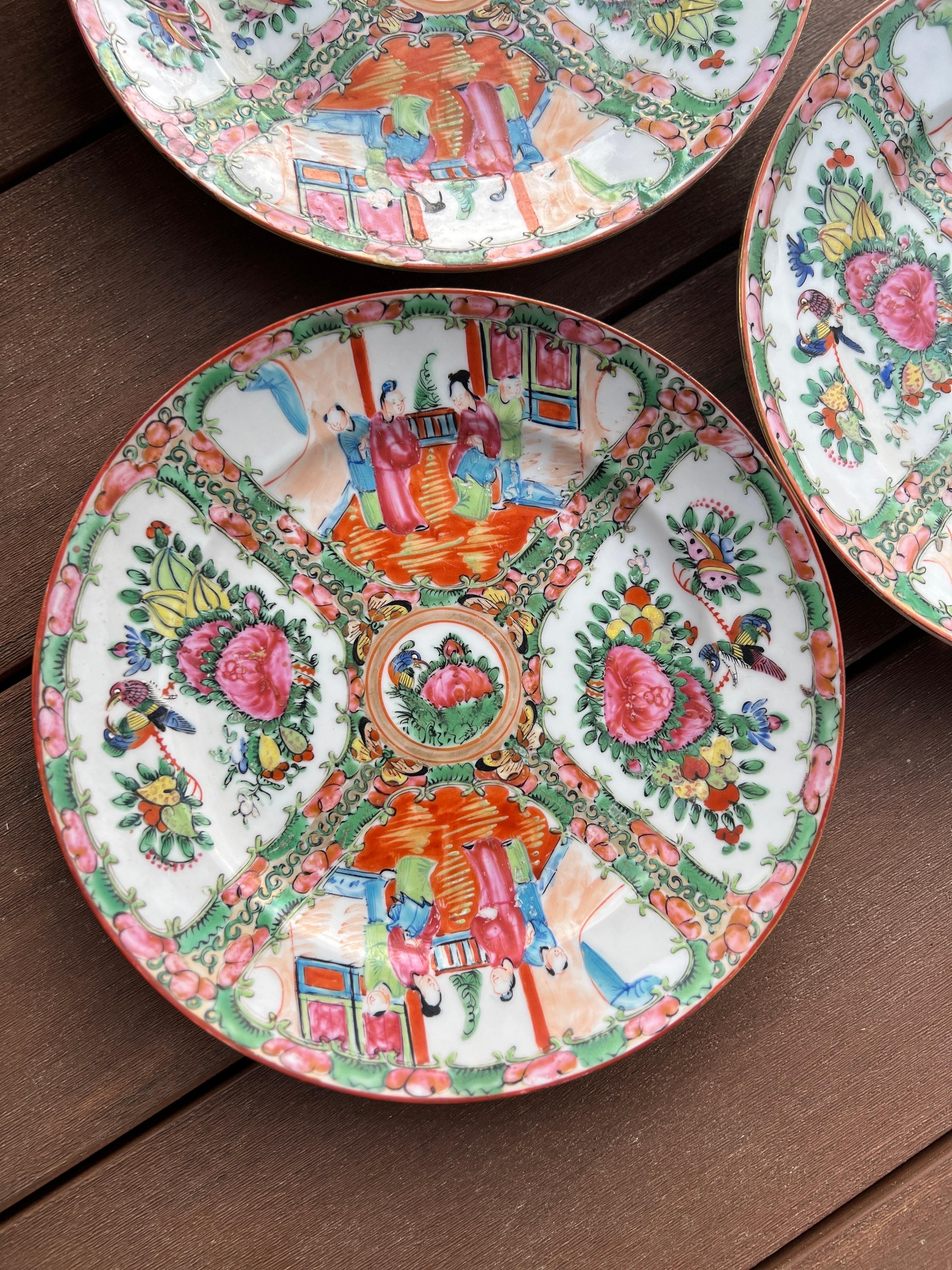 Sold as a set of 5 plates. Enamel decorated with figural windows and gilt decoration to center.