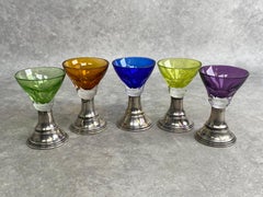 Set of 5 colored cut glasses on silver stems