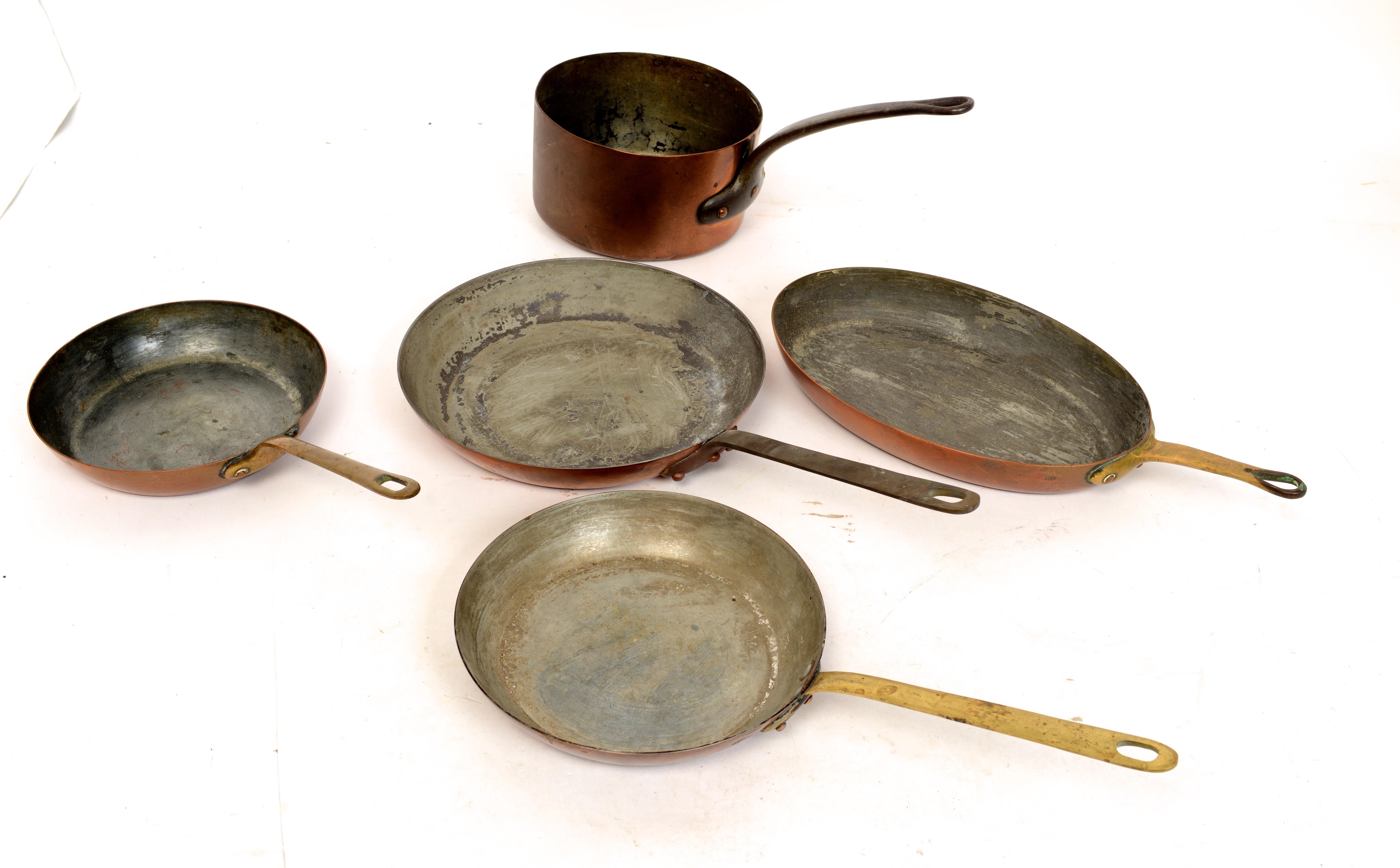 Set of 5 copper pans assorted makers in original condition with great patina. The pans all with traditional bronze handles which are riveted on.
1. Saucepan marked 