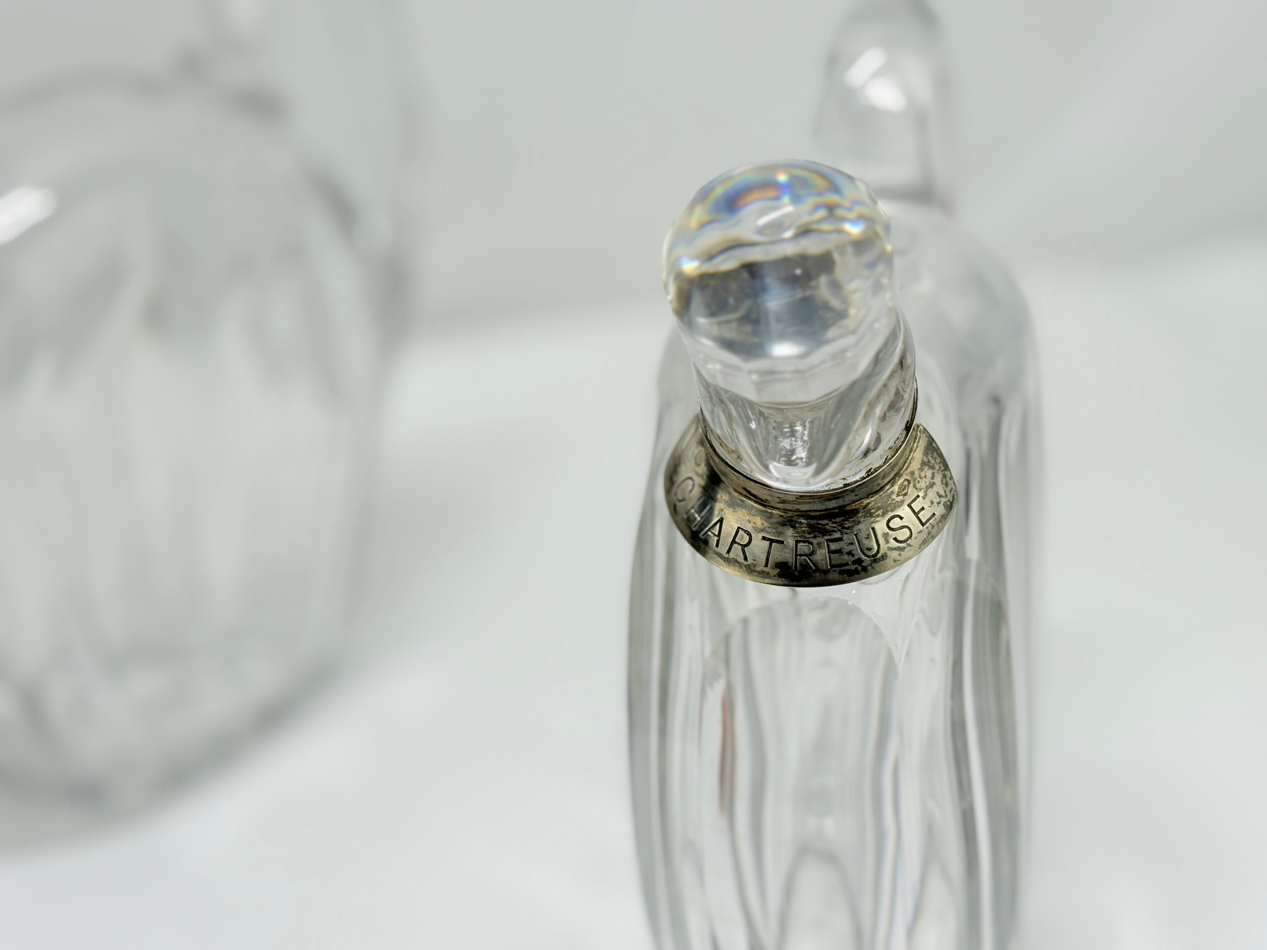 Set of 5 Crystal Liqueur Decanters by Jacques Adnet for Baccarat
French, Circa 1930

An exceptional suite of five crystal liqueur decanters designed by Jacques Adnet (1900–1984) for Baccarat, circa 1930, each fitted with a sterling silver collar