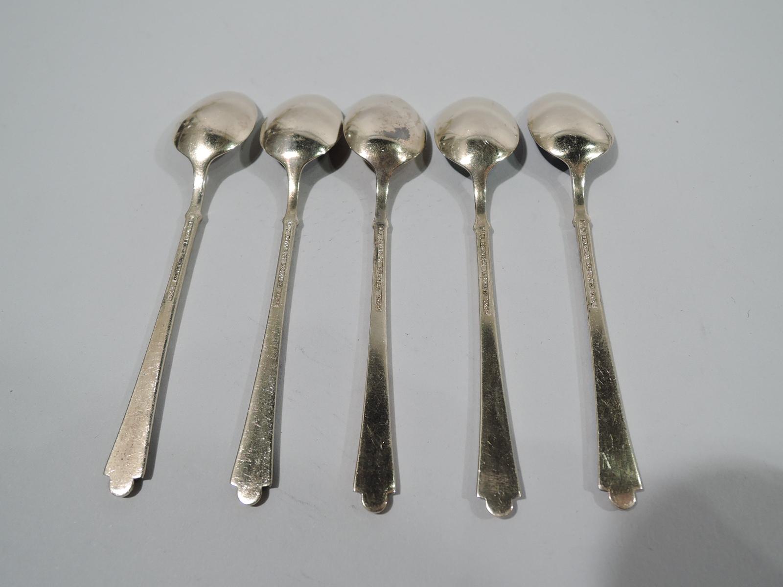 Set of 5 Mid-Century Modern gilt sterling silver and guilloche enamel demitasse spoons. Made by Egon Lauridsen in Denmark. Oval bowl with scalloped enameling. Tapering handle with ball terminal and enameling in diagonal silver gilt frames. Reverse