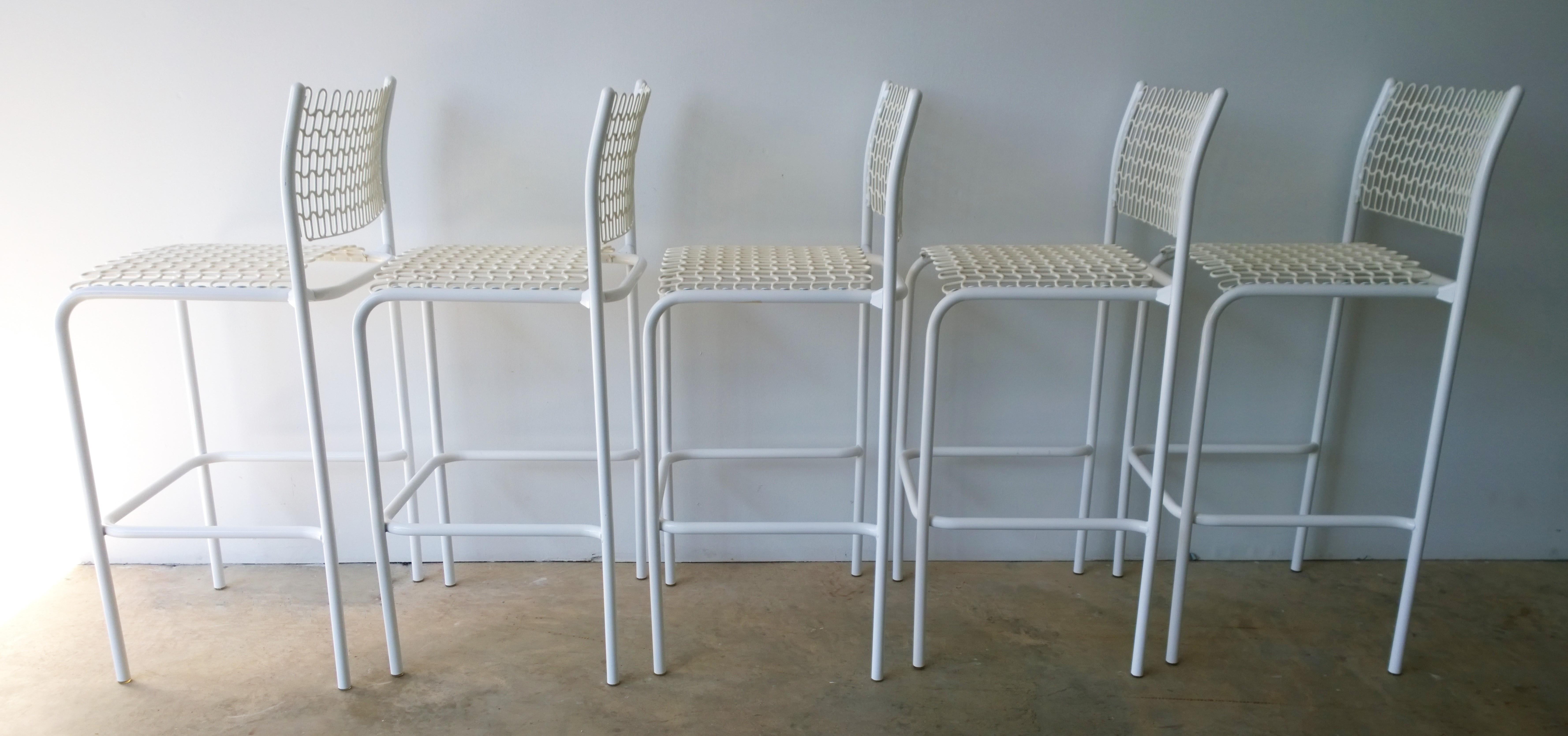 Offered are a set of five Mid-Century Modern Sof-tek white patio indoor or outdoor bar stools designed by David Rowland for Thonet. These bar stools feature a rubber mesh seat and an enameled in white tubular chrome frame that make them look and
