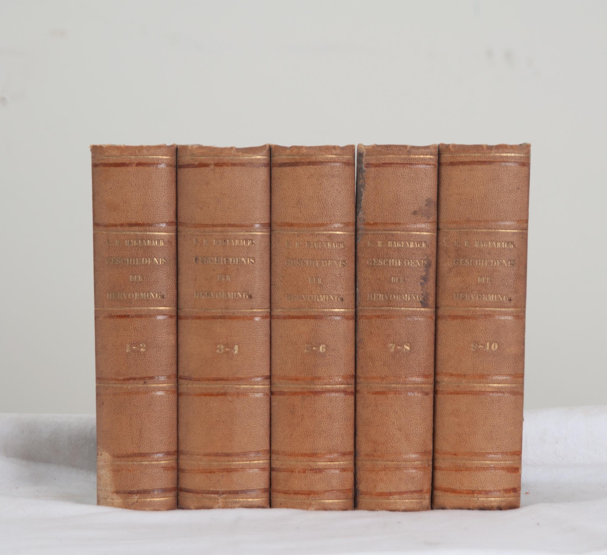 A collection of five volumes on Dutch history by Dr. K. R. Hagenbach. This set of books is leather bound with the title, author, and respective volume number stamped in gold lettering. The Dutch title “Het Wezen en de Geschiedenis der Hervorming''