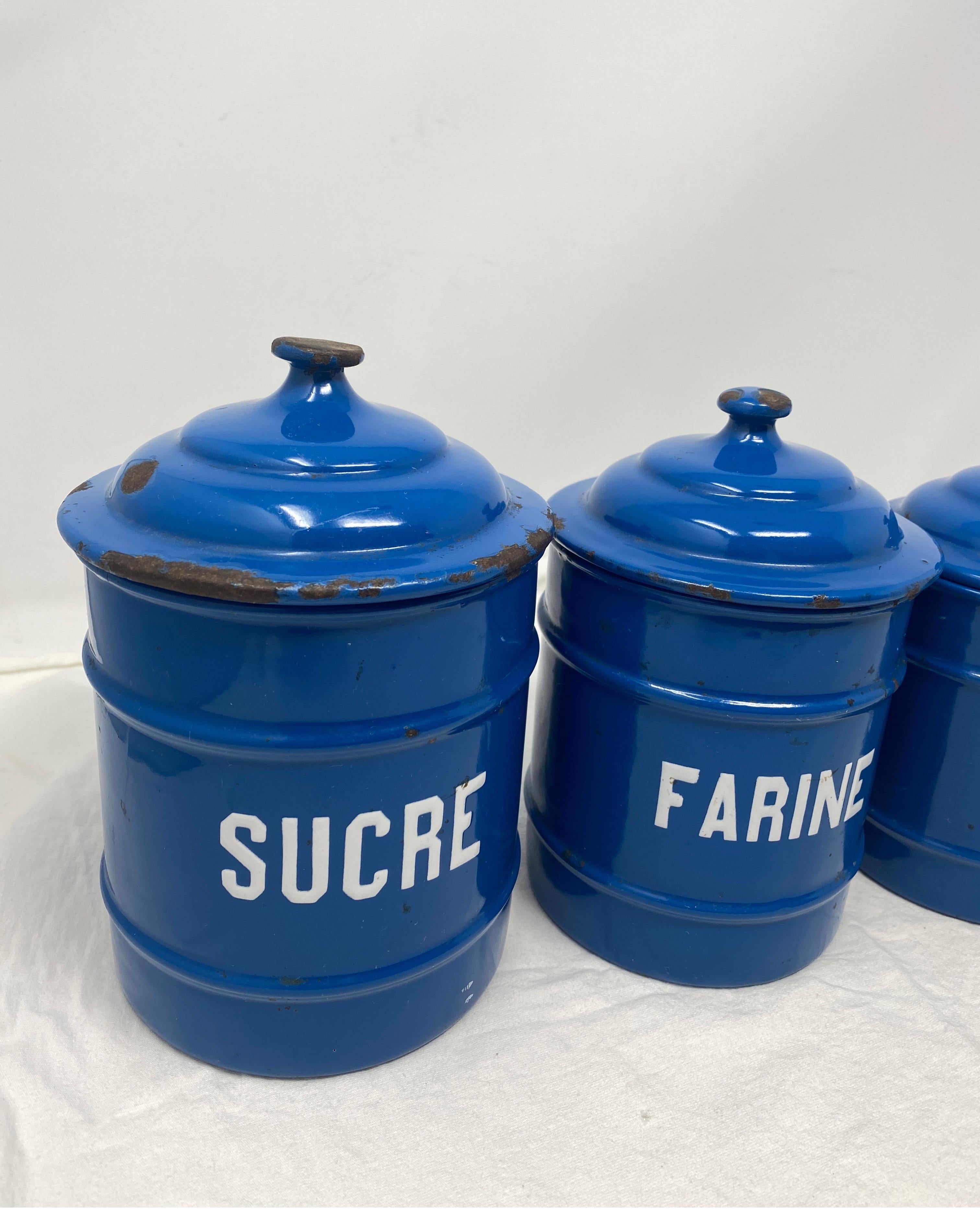 We found this French antique set of 5 enameled canisters, circa 1920s in Southern France. The charming canisters complete with their original lids, once a staple in every French kitchen, are cobalt blue with white raised print and are graduated in