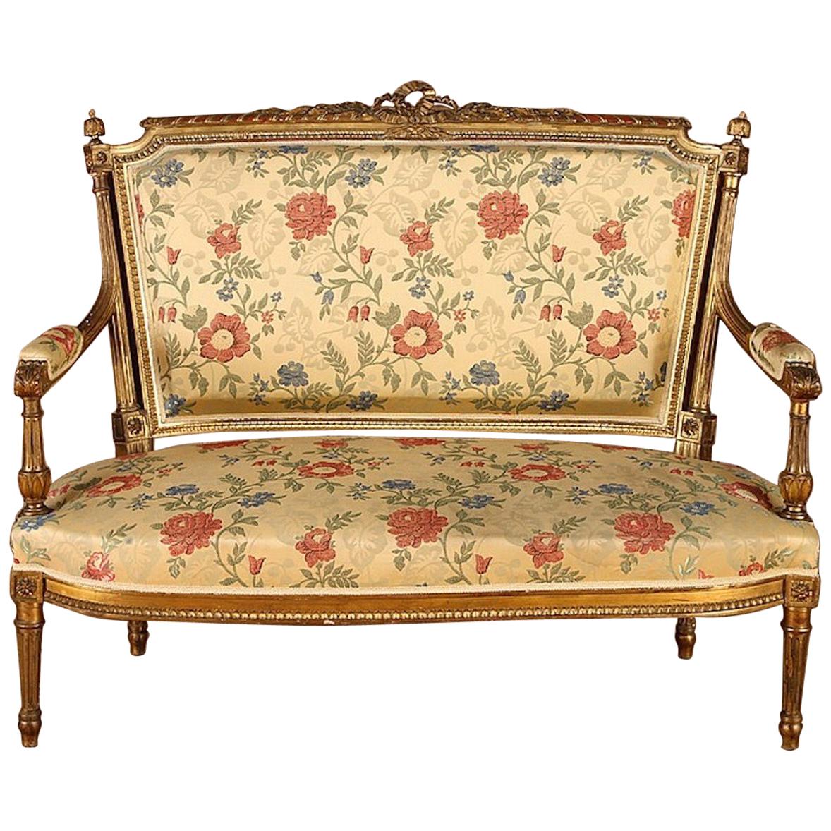 Set of 5, French giltwood Louis XVI style settee and 4 French giltwood open armchairs.
Measures: Settee: Height 41
