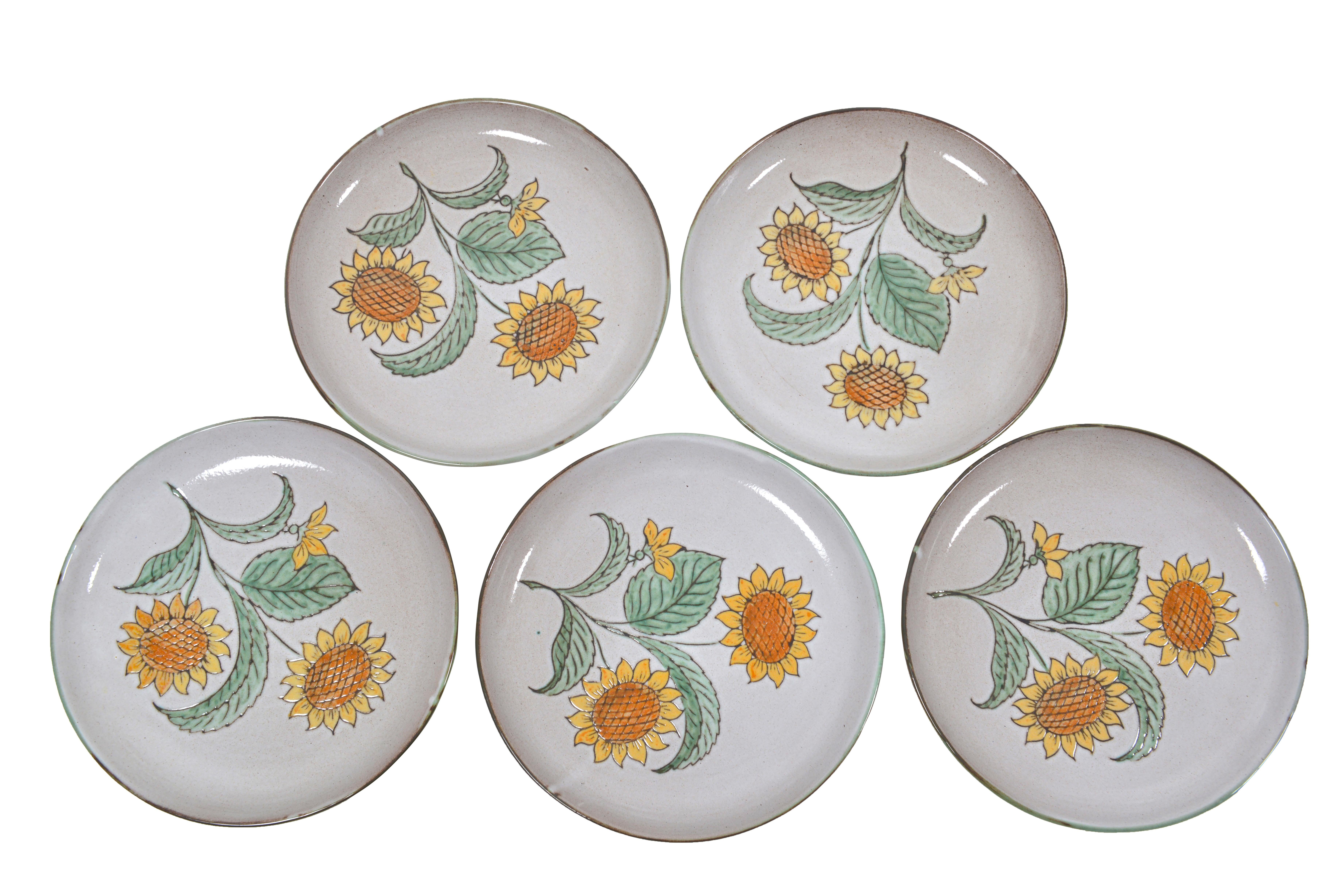 Charming set of five big plates or serving platters in ceramic, made in Vallauris, France, circa 1950. Beautifully delicately painted sunflowers. Excellent condition!