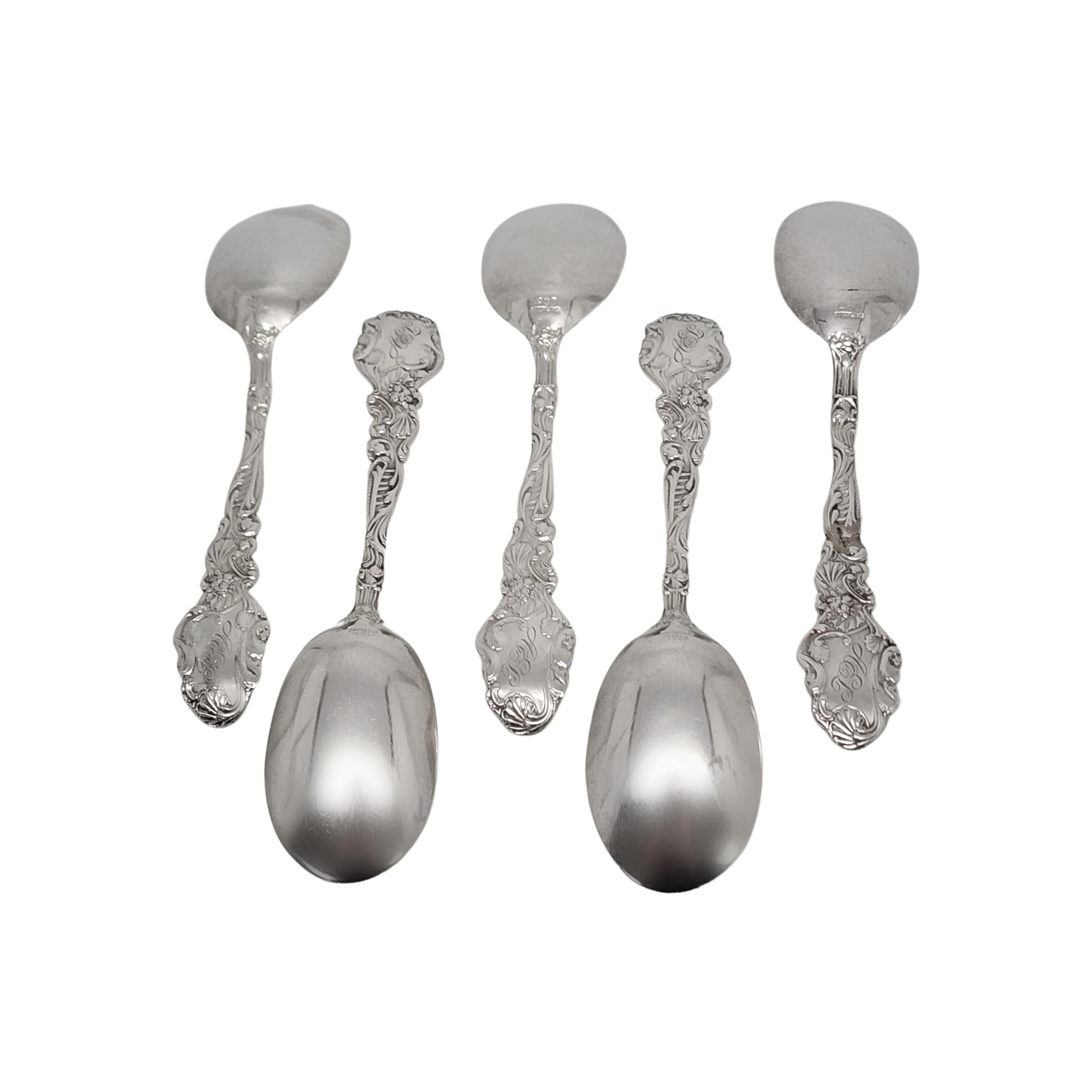 Set of 5 sterling silver small ice cream spoons by Gorham in the Versailles pattern with monogram.

Monogram appears to be AEL on the back of the handle

Gorham's Versailles is a multi motif pattern designed by Antoine Heller in 1885. Named for the