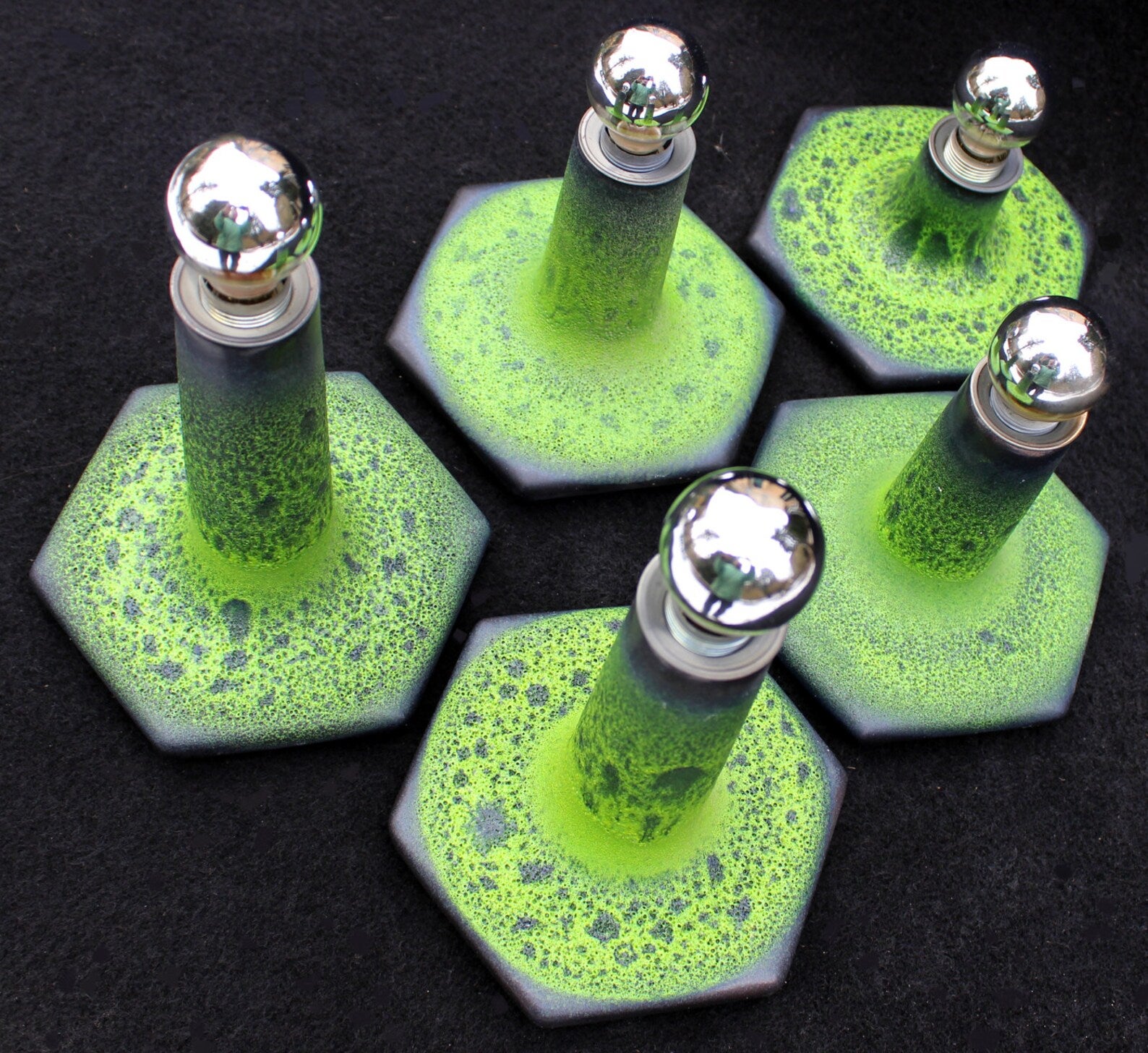 ENSEMBLE OF 5FAT (GREEN) LAVA FANTASTIC GERMAN STUDIO POTTERY SCONCES IN FINE GREEN NUANCED GLAZE. PLEASE CONSIDER THAT THE MEASUREMENTS OF THE SCONCES VARY

This spectacular designed and coloured ensemble of sconces is in nearly perfect