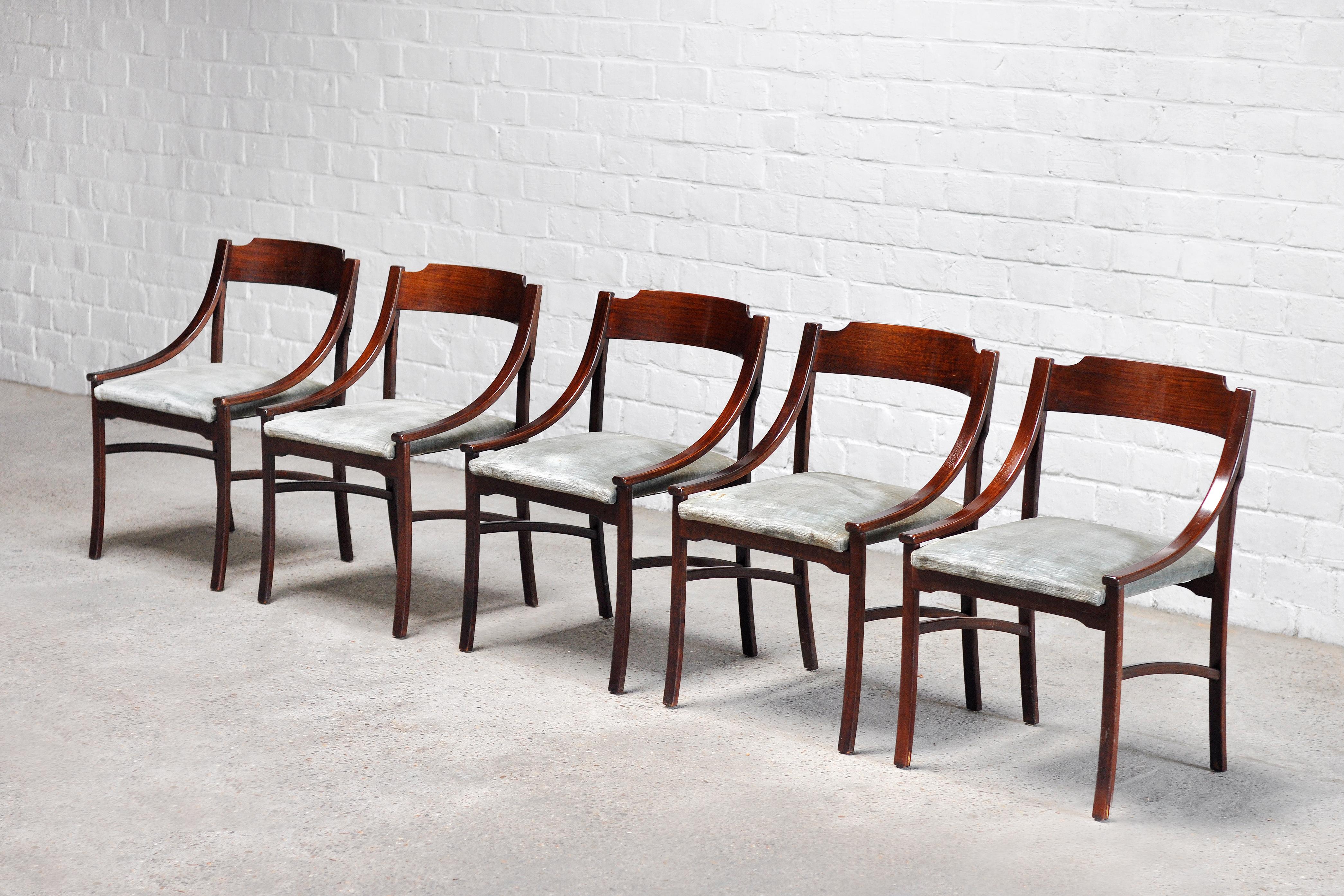 A set of 5 dining chairs designed and made in Italy in 1960’s. Attributed to Ico Parisi, these chairs are a variant of the '110' model.  They showcase a warm rosewood frame and backrest with distinct architectural lines and forms. The original