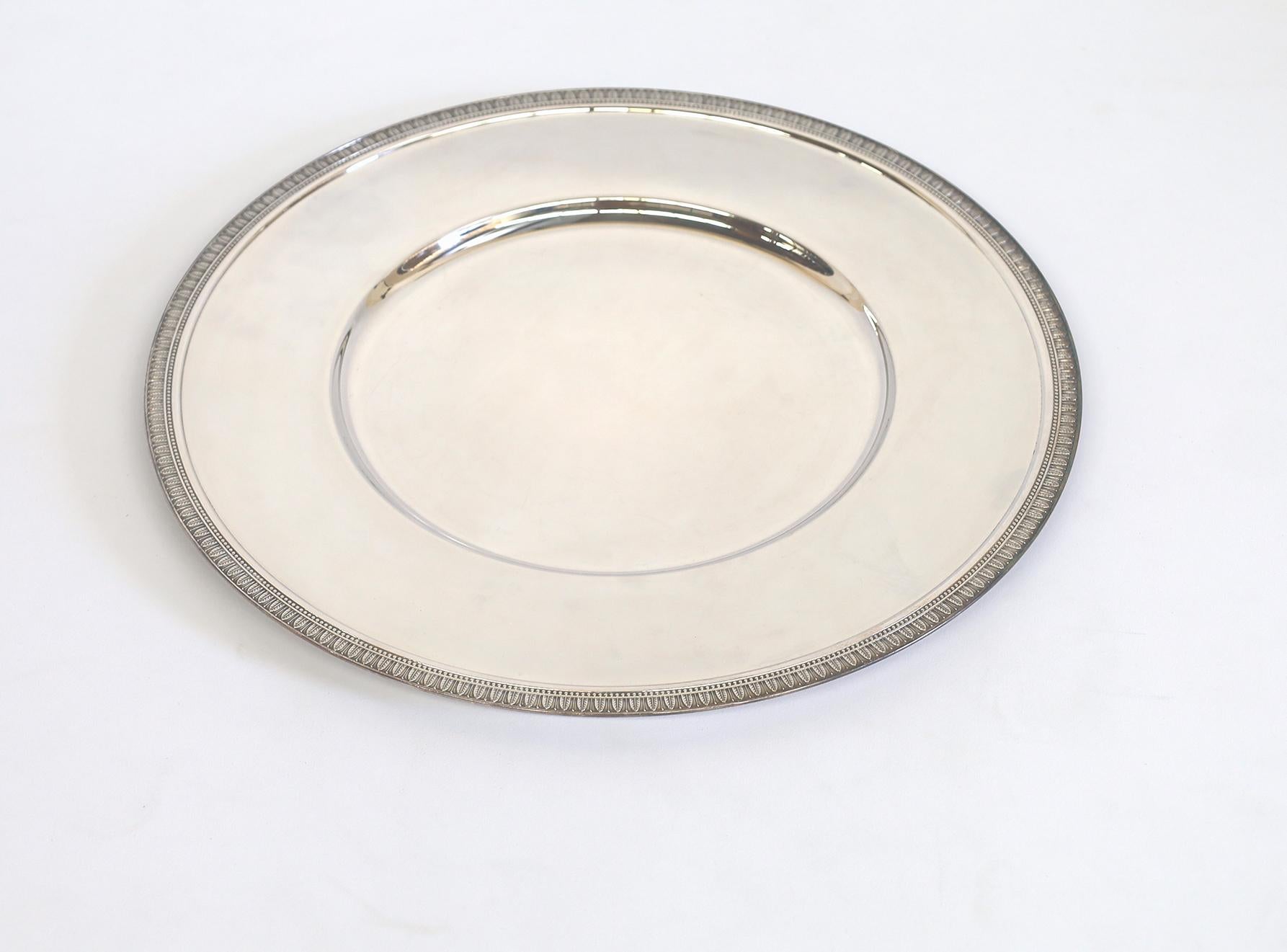 Set a refined and elegant table with a silver plated charger/presentation plate in the Malmaison pattern. It goes under dinner plates for added pop. One of Christofle's most historic patterns, Malmaison typifies the Empire style, with its frieze of