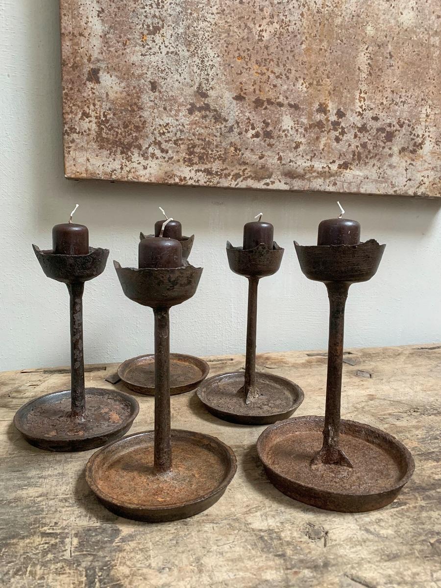 A set of 5 late 19th century Provincial Chinese candlesticks holders. Lovely shape, great patina, practical to use.
