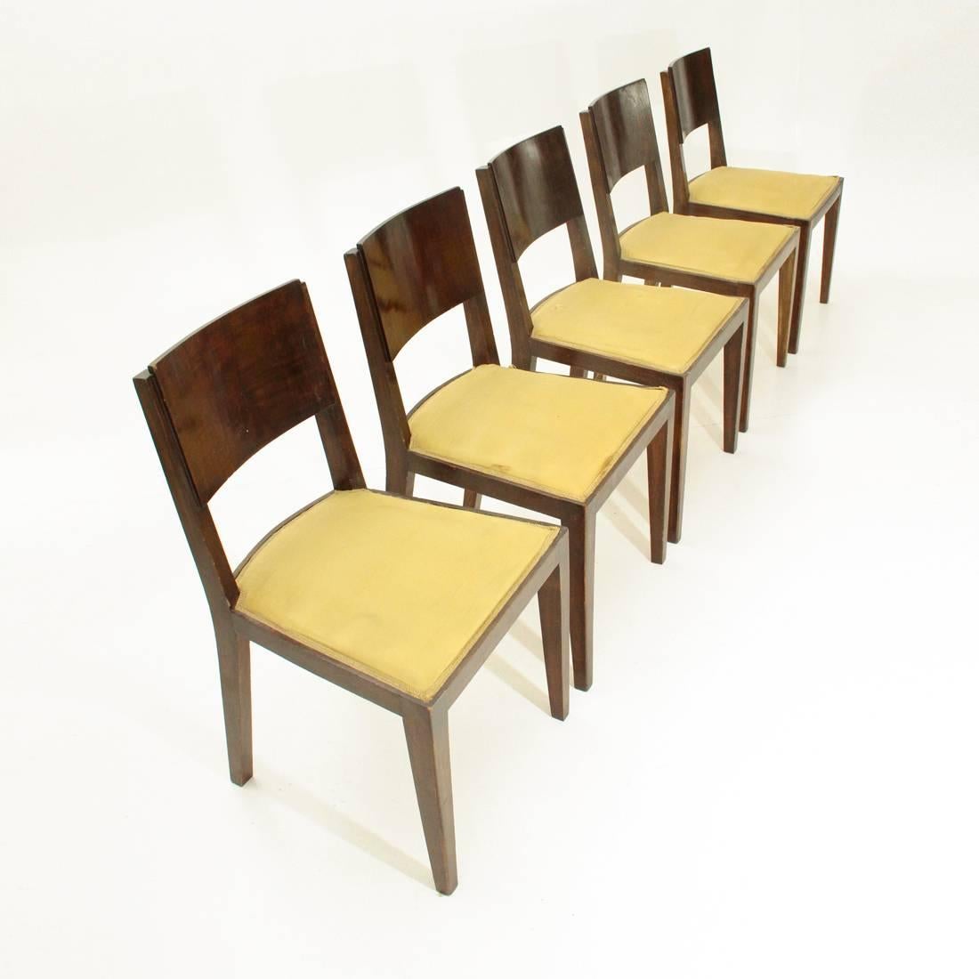 Set of five Italian production chairs from the 1940s.
Structure and back in veneered wood.
Seat padded and lined in original yellow fabric of the time.
Structure in good condition, some signs due to normal use over time, padding and fabrics to be