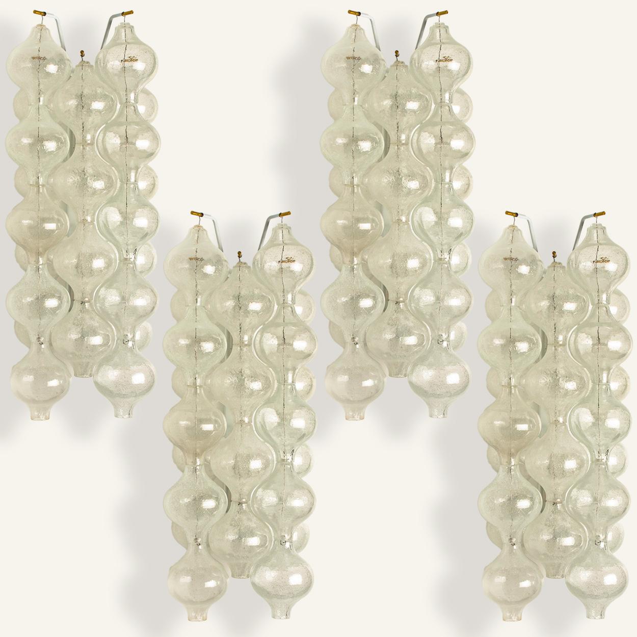 5 unique large and elegant 'Tulipan' glass wall sconces by J.T. Kalmar, Austria, Vienna, manufactured in midcentury, circa 1970 (late 1960s or-early 1970s). Tulip shaped hand blown bubble glasses. With a white enameled metal frame which holds 5 long