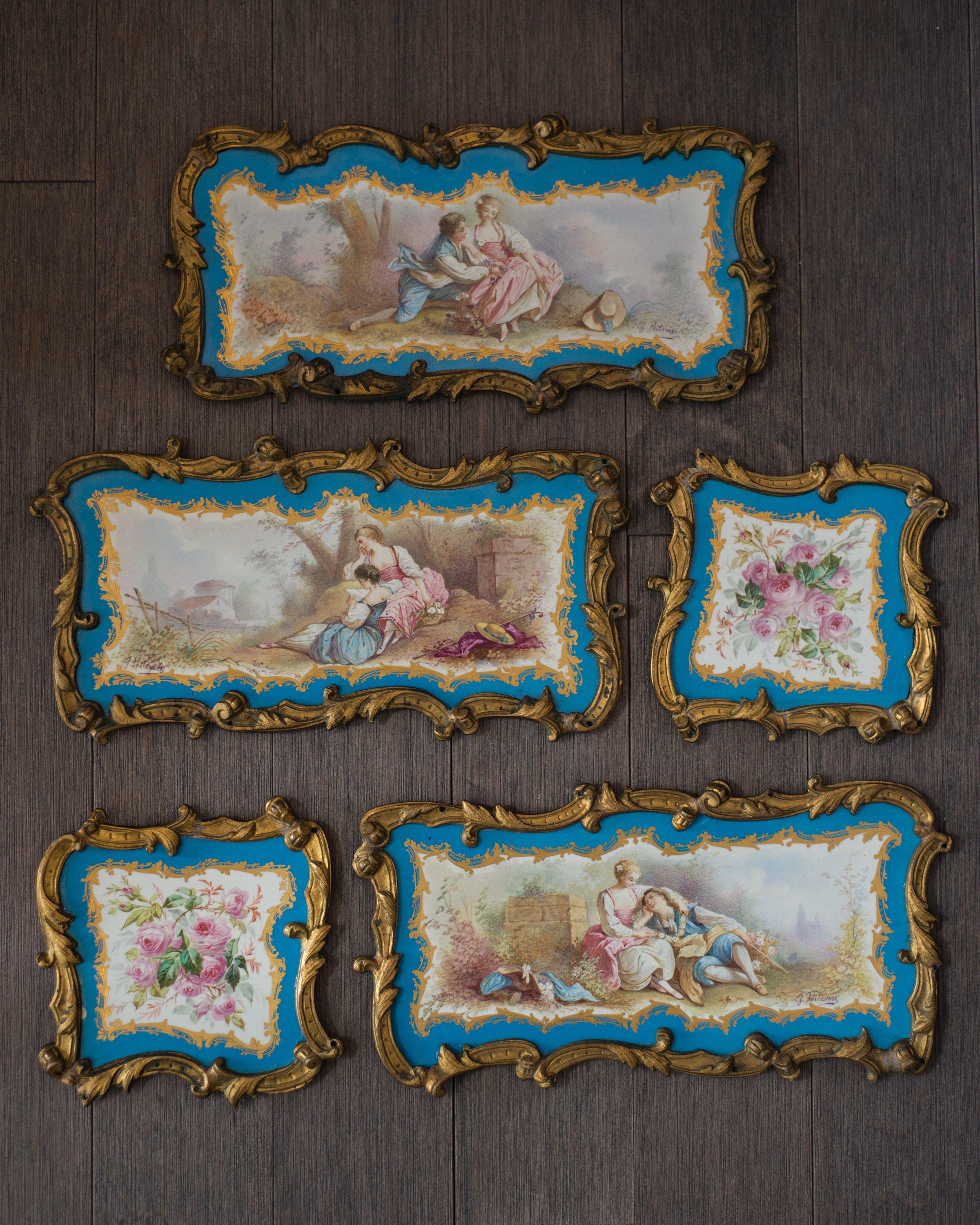 A fine set of Louis XVI Sèvres style hand painted porcelain and bronze plaques, signed E. Poitevin, circa 1890. This set includes 3 large plaques and 2 small plaques to be arranged in a multitude of ways. Each plaque is framed by bronze filigree