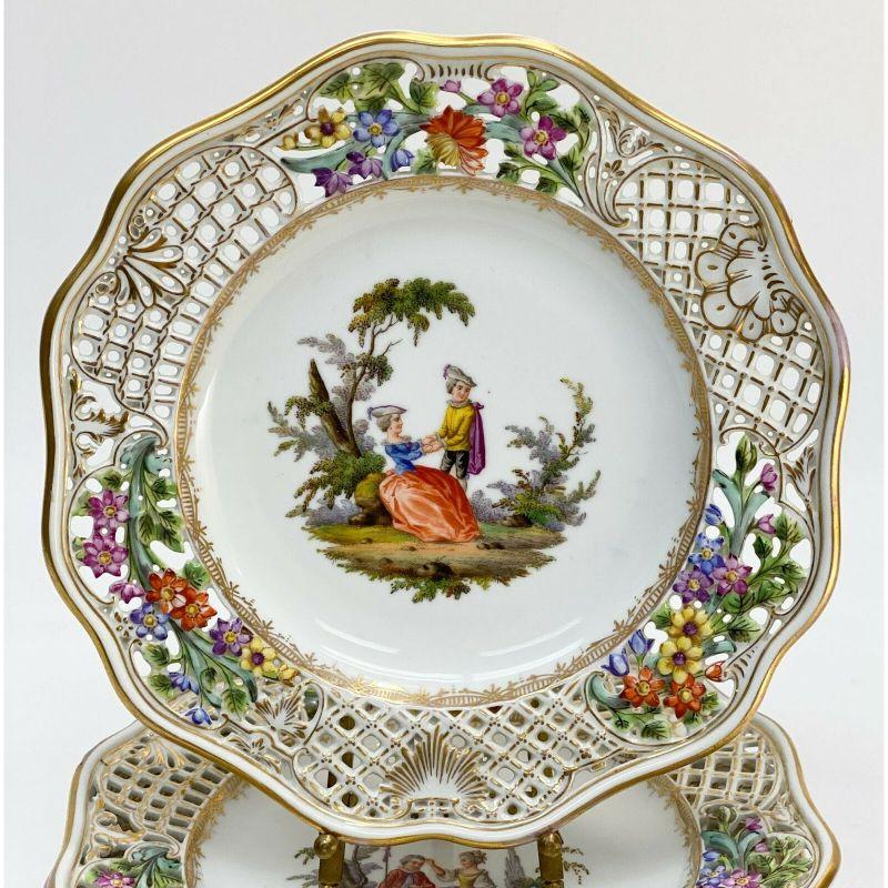 Set of 5 Meissen Germany hand painted porcelain dessert plates, 19th Century

5 Meissen Germany hand painted porcelain dessert plates, 19th century. Reticulated basketweave edge with florals and gilt accents. Various hand painted images of two